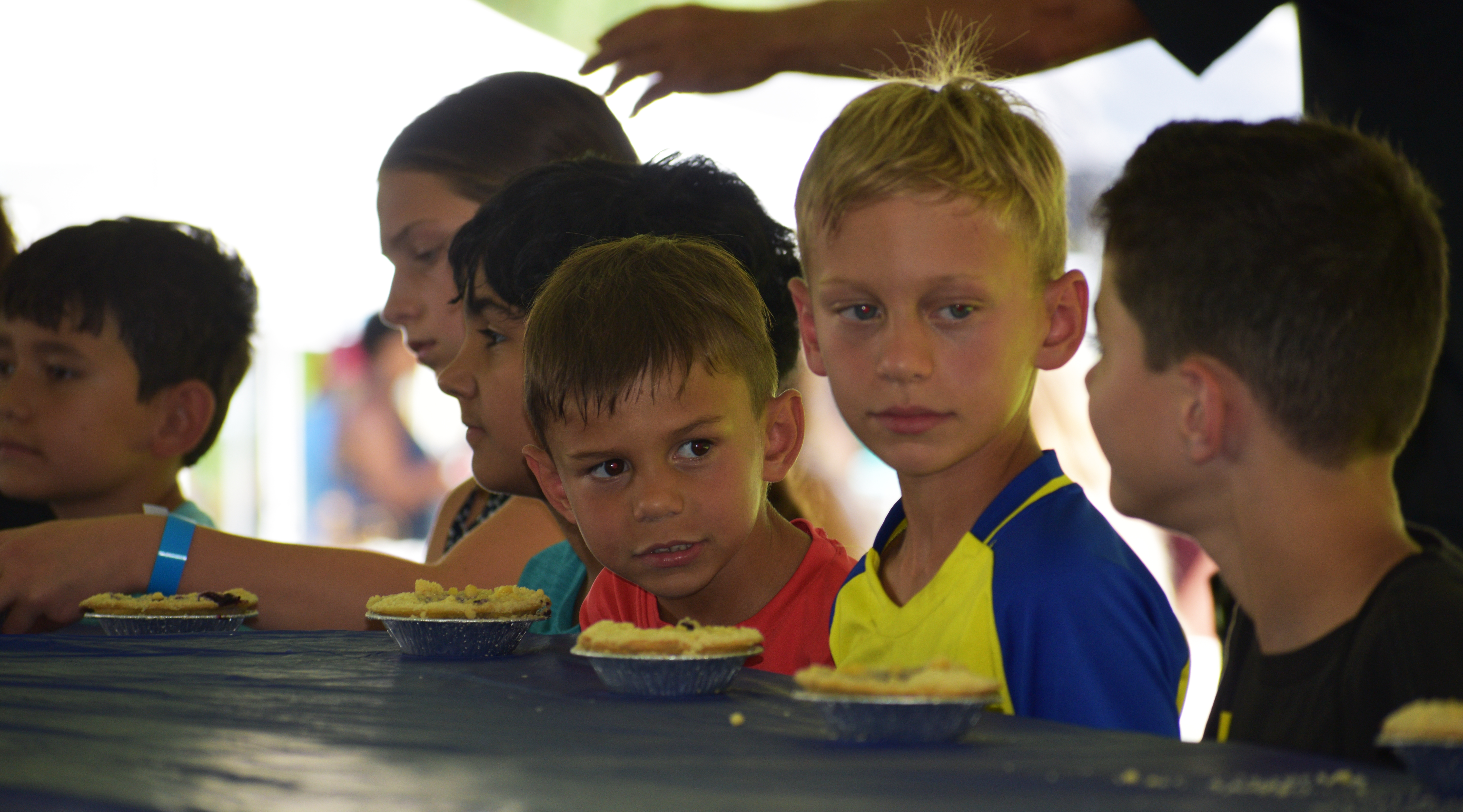 Contestants go head-to-head in the children’s hands-free blueberry pie-eating contest as Historic Bethlehem Museums & Sites hosts the first of two days of its Blueberry Festival & Market To Go on Saturday, July 13, 2024, at Burnside Plantation.