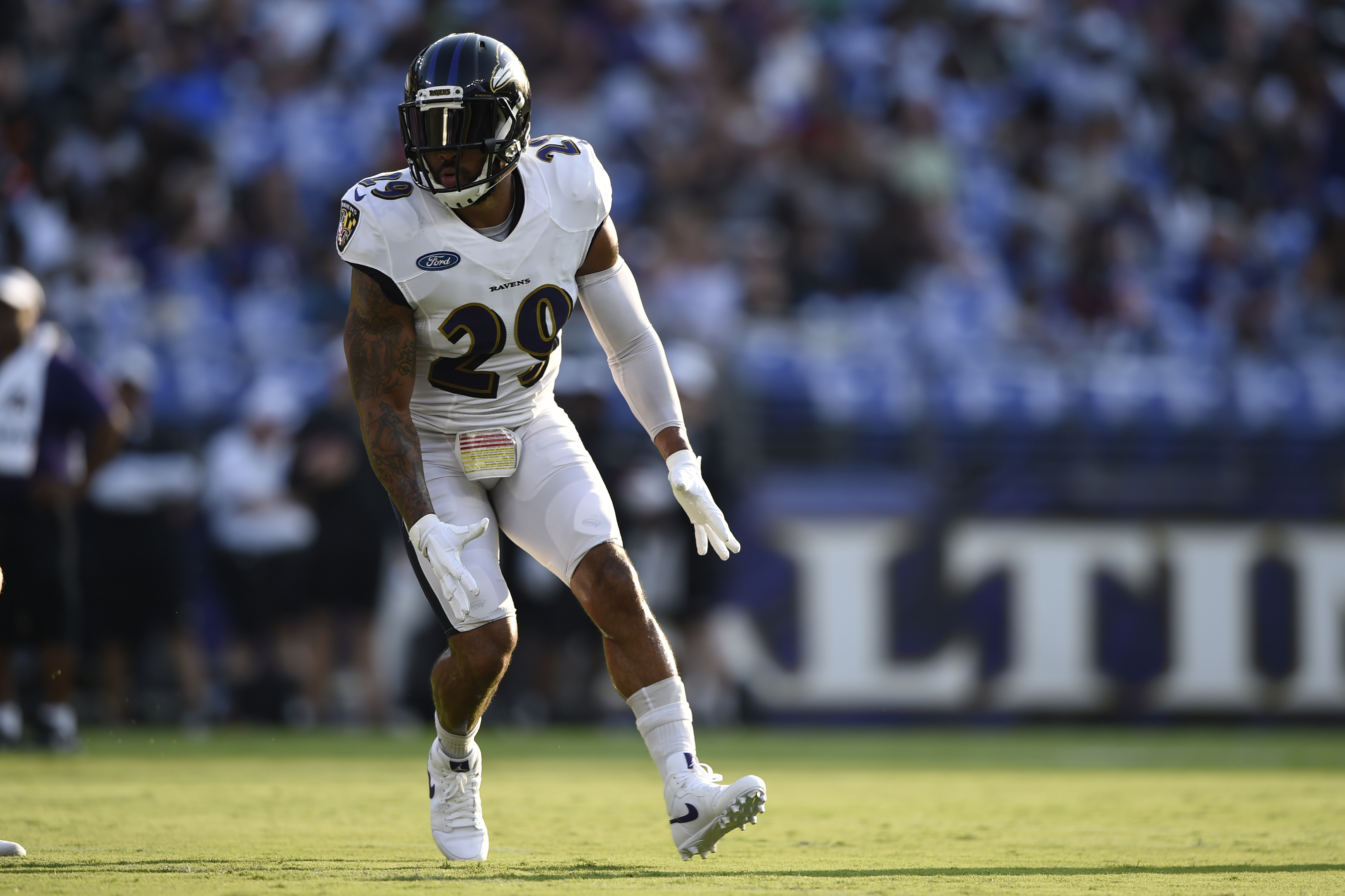Ravens' Marcus Peters, John Harbaugh get into heated exchange on
