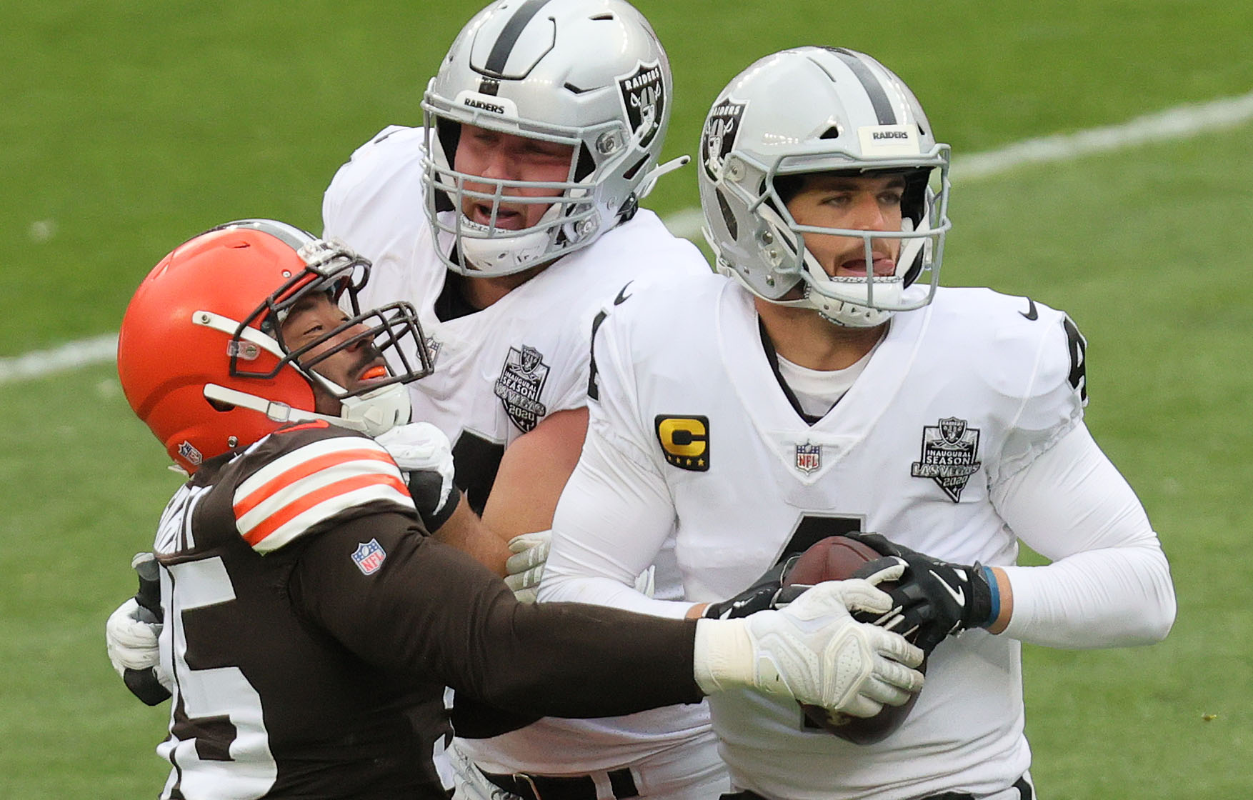 Cleveland Browns tight end Harrison Bryant (88) fumbles the football while  being tackled by Las …