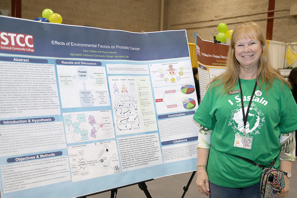 STCC student Karin O’Brien and her Sustainability poster  at the Sustainathon event taking place in the gym in building 2 at Springfield Technical Community College on April 11th. (Ed Cohen Photo) 