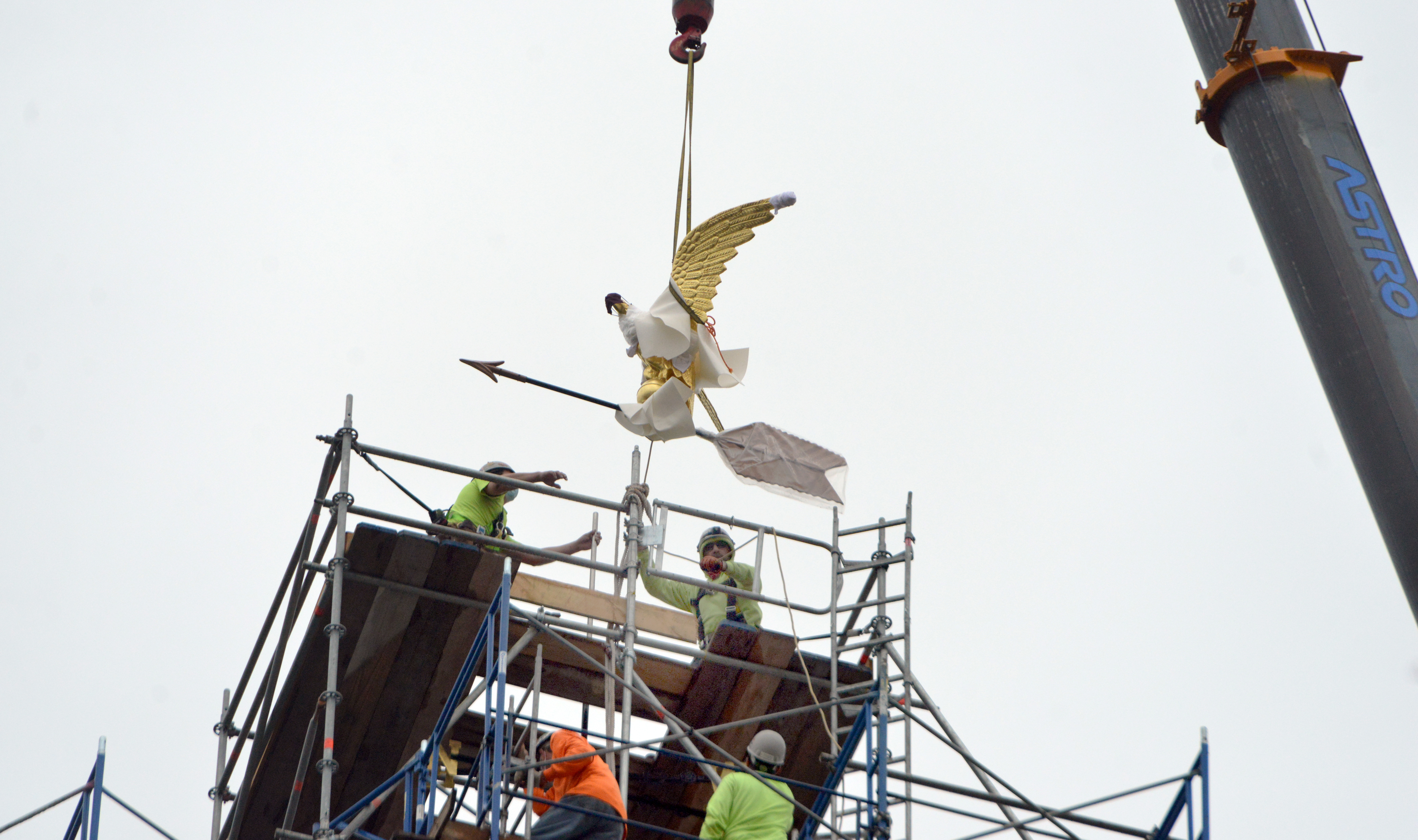 10/6/2020 -Chicopee-   A replica of  the "Chicopee Eagle Weathervane" is placed on top of the City Hall Clock Tower, now undergoing renovations. The original eagle will be on display in the City Hall auditorium once building renovations are complete.   (Don Treeger / The Republican)