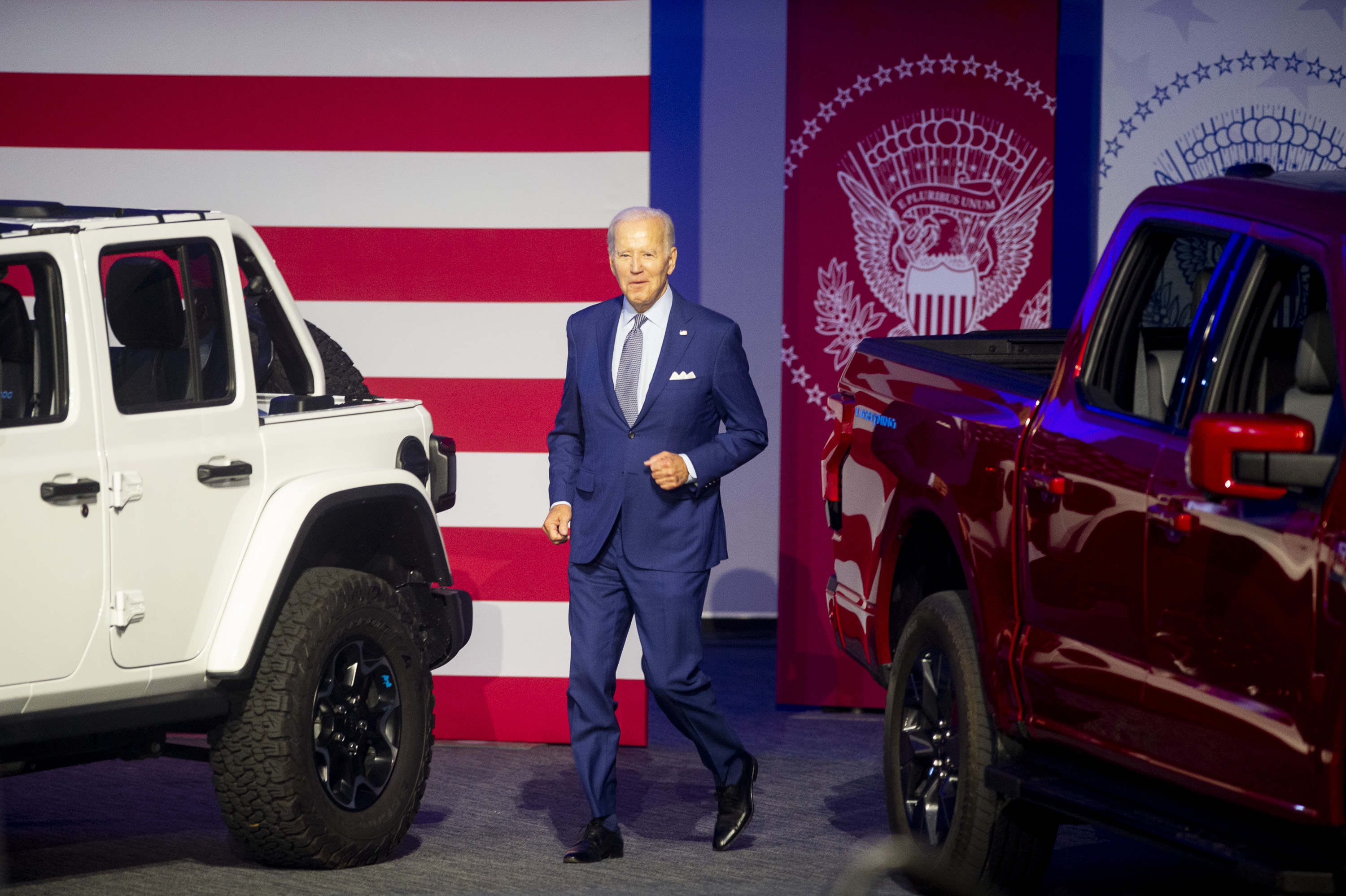 U.S. President Joe Biden jogs to the stage during the 2022 North American International Auto Show at Huntington Place in Detroit on Wednesday, Sept. 14 2022.