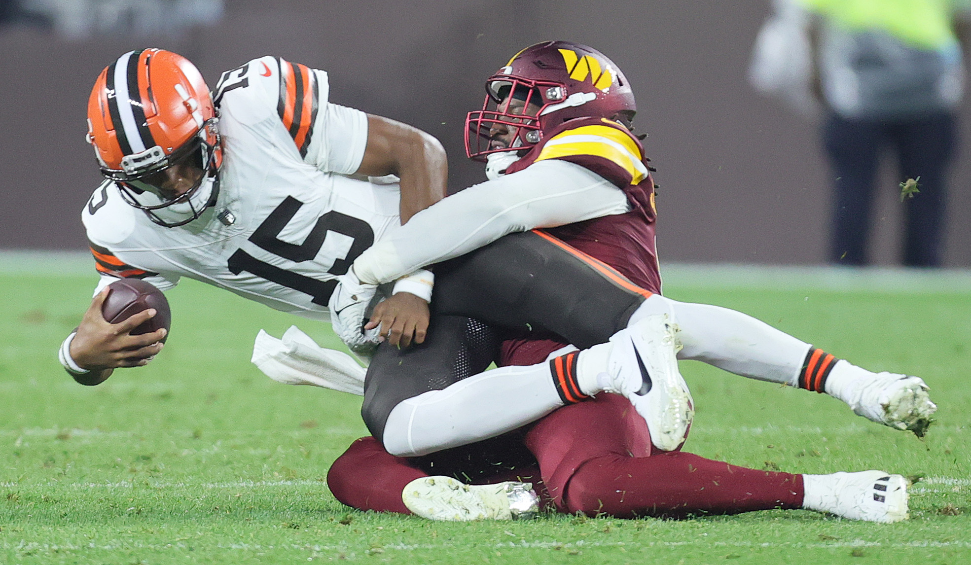 Washington Commanders defensive end Chase Young (99) warms up prior to the  start of an NFL pre-season football game against the Cleveland Browns,  Friday, Aug. 11, 2023, in Cleveland. (AP Photo/Kirk Irwin