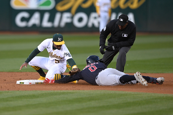 Oakland Athletics shortstop Aledmys Diaz (12) throws to first as Cleveland  Guardians' Steven Kwan (38) slides into second on a double play hit into by  Jose Ramirez during the third inning of