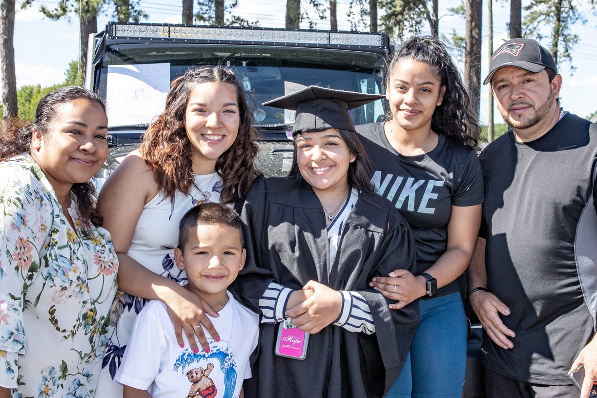 Joshlyn Castellanos and family pose for a photo at the Veritas Prep Charter School 8th grade 2020 DRIVE-In Graduation held in the parking lot of the Eastfield Mall. (Danny Nason Photo