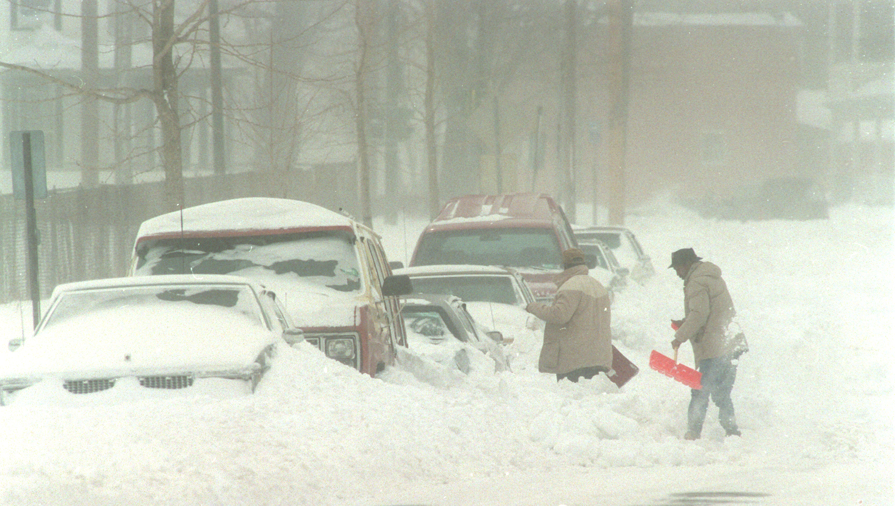 People dig their cars out of the snow on Oakwood Avenue after the Blizzard of 1993.