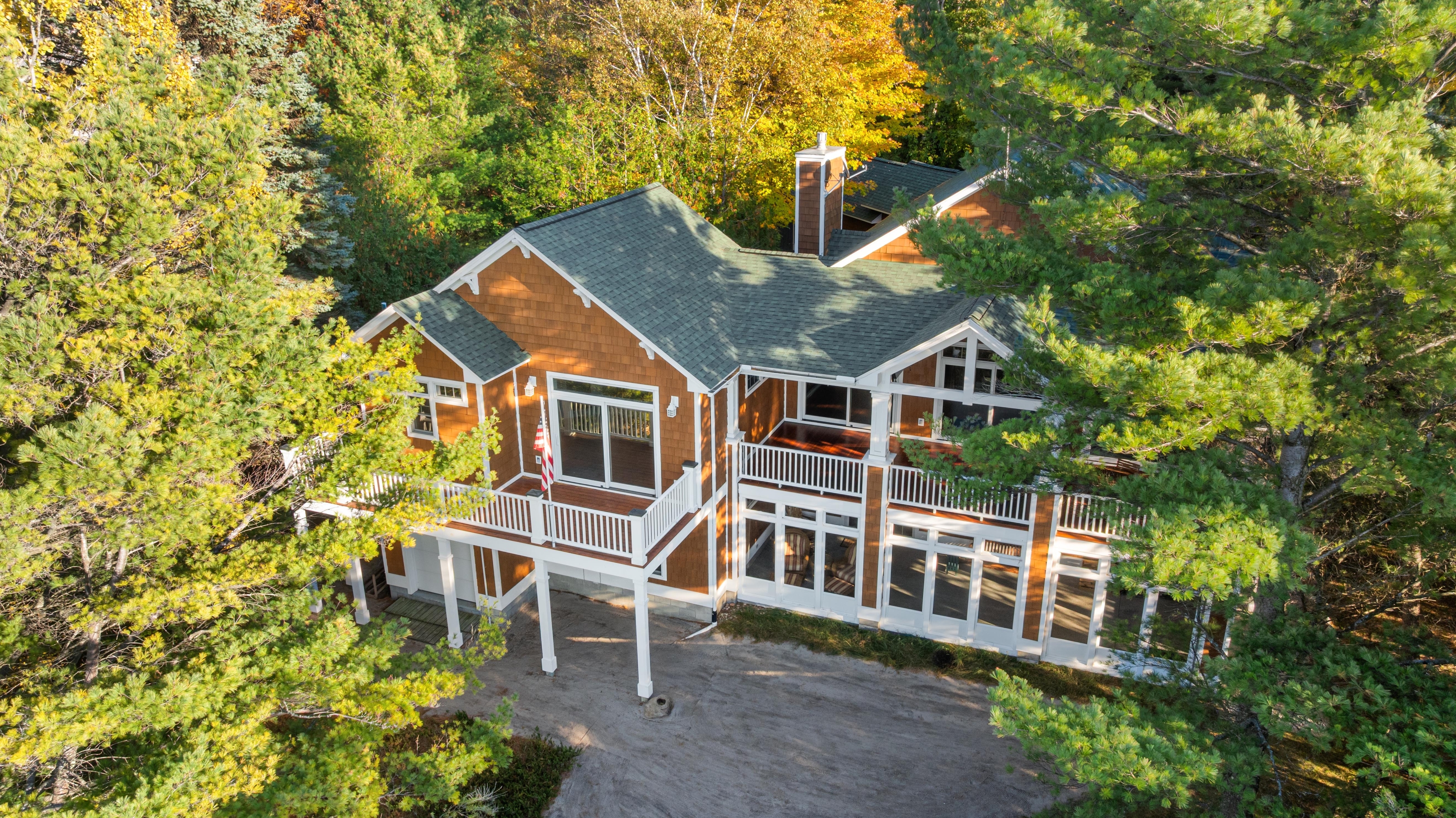 Aerial photographs of 4093 Lake Shore Drive in Charlevoix, this gem is listed at $2,099,900 through Berkshire Hathaway HomeServices Michigan Real Estate – Traverse City and The Crane Group with associate broker Johnny Crane and his brother, co-listing agent Matt Crane.