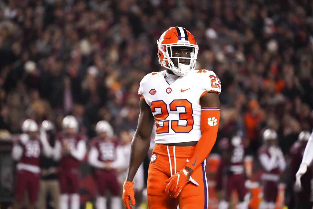 January 1, 2021: Clemson defensive back Andrew Booth Jr. (23) tries to  bring down Ohio State receiver Chris Olave (2)during the Allstate Sugar  Bowl Classic Playoff Semifinal game between the Clemson Tigers