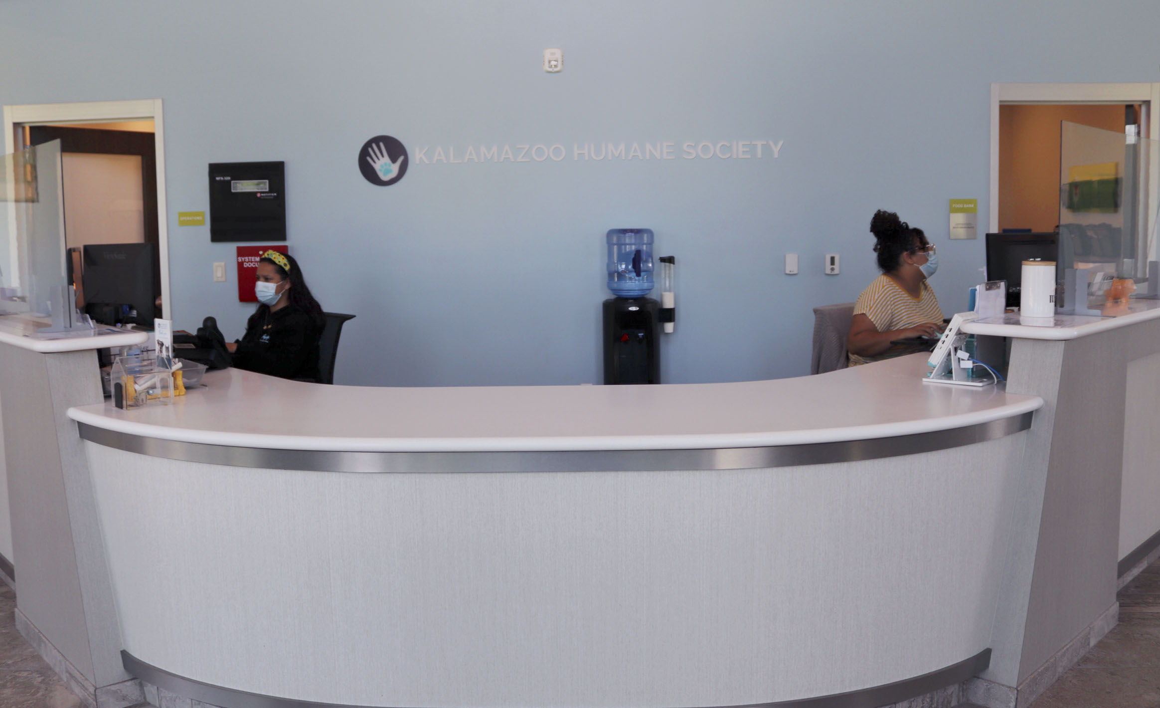 Two employs work are front desk on Tuesday, Aug. 23, 2022, at Charles and Lynn Zhang Animal Care & Resource Center in Kalamazoo.
