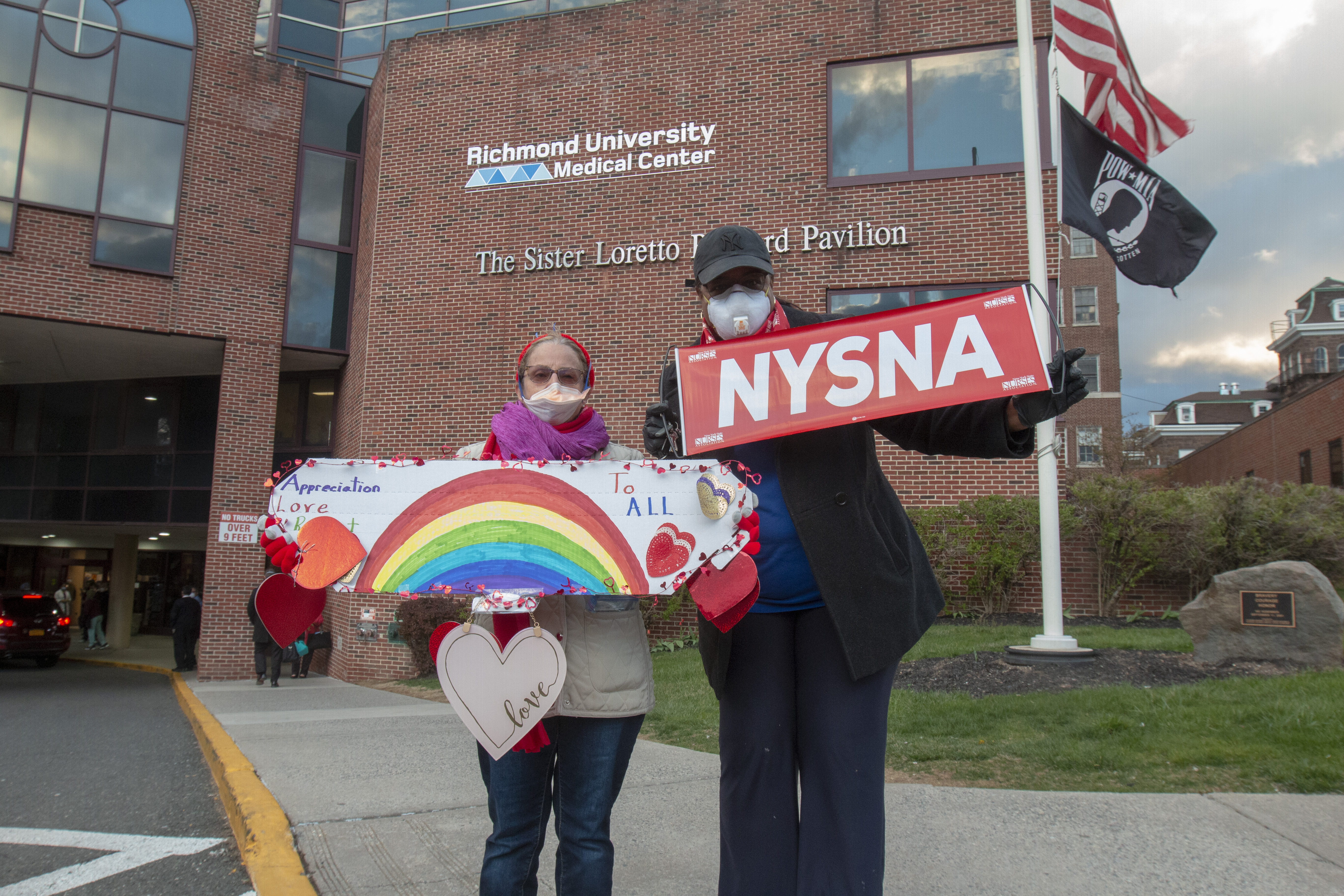 Staten Islanders came to West Brighton on Friday, April 10, 2020, to show their support for healthcare workers at Richmond University Medical Center. Joan Rowley, left, and Selina Grey,  of the New York State Nurses Association, delivered supplies to the hospital.  (Staten Island Advance/ Paul Liotta)