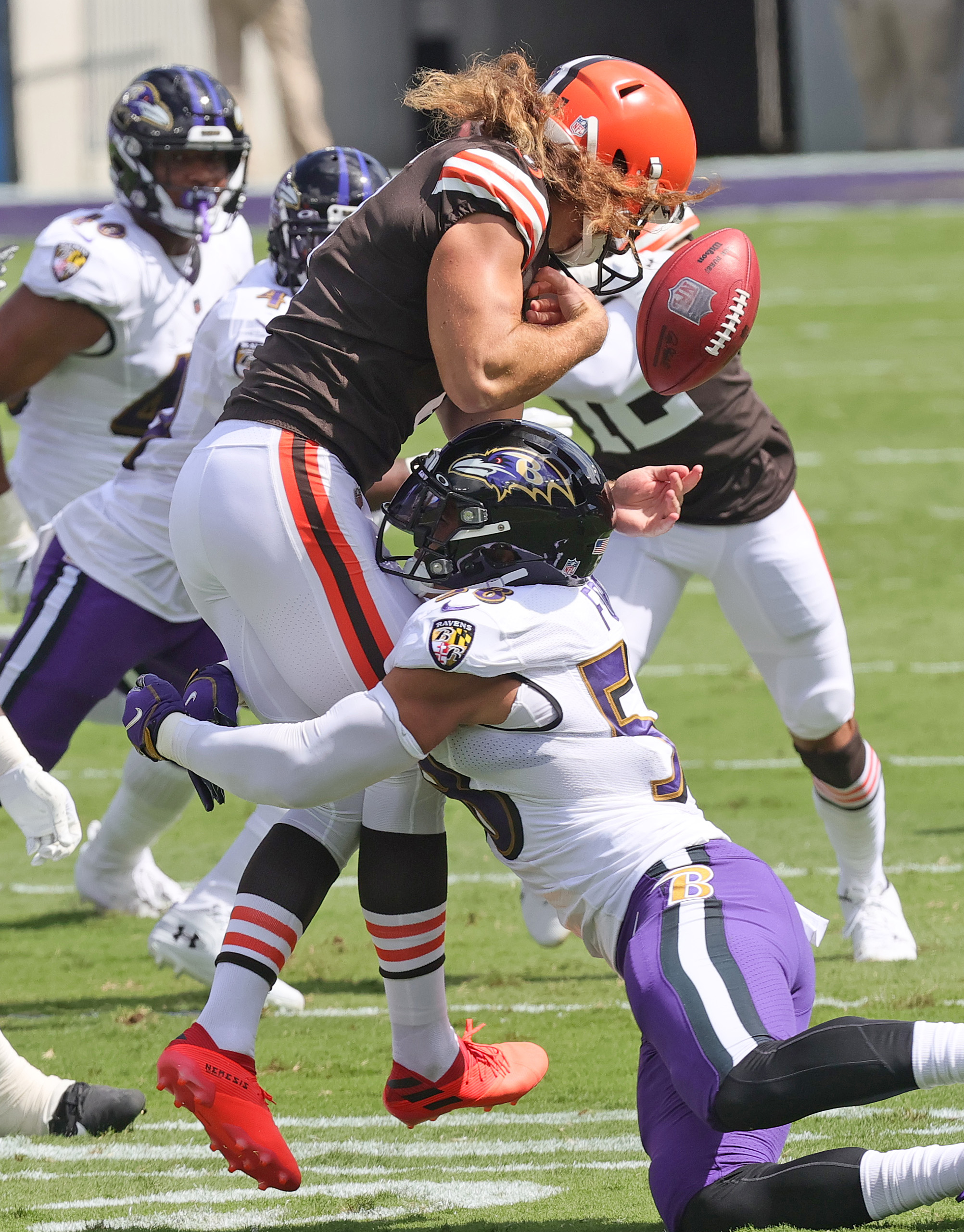 Baltimore Ravens linebacker Patrick Queen (6) greets quarterback