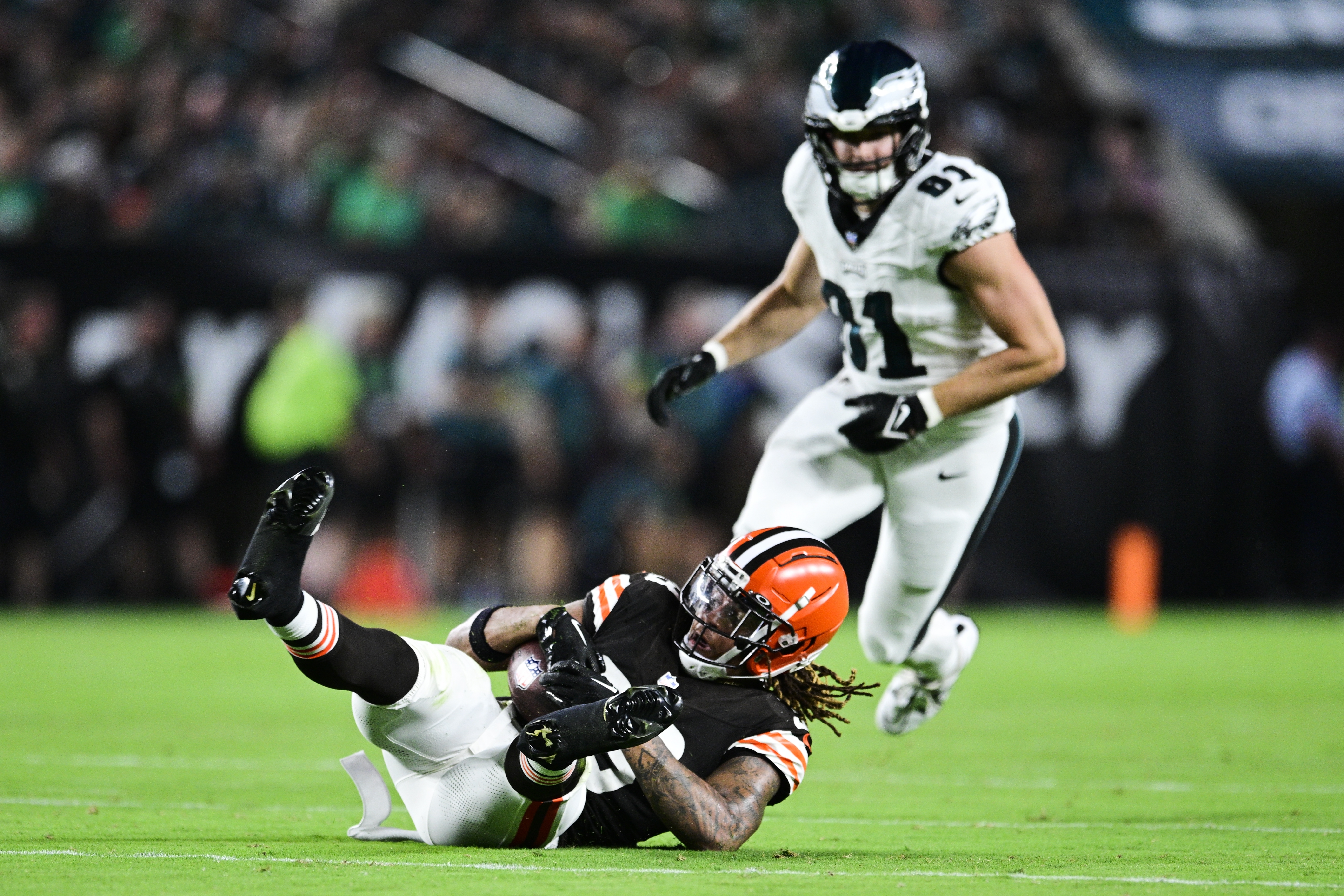 Cleveland Browns safety Ronnie Hickman Jr. intercepts a pass in front of Philadelphia  Eagles tight end Grant Calcaterra (81) during the first half of an NFL  preseason football game Thursday, Aug. 17