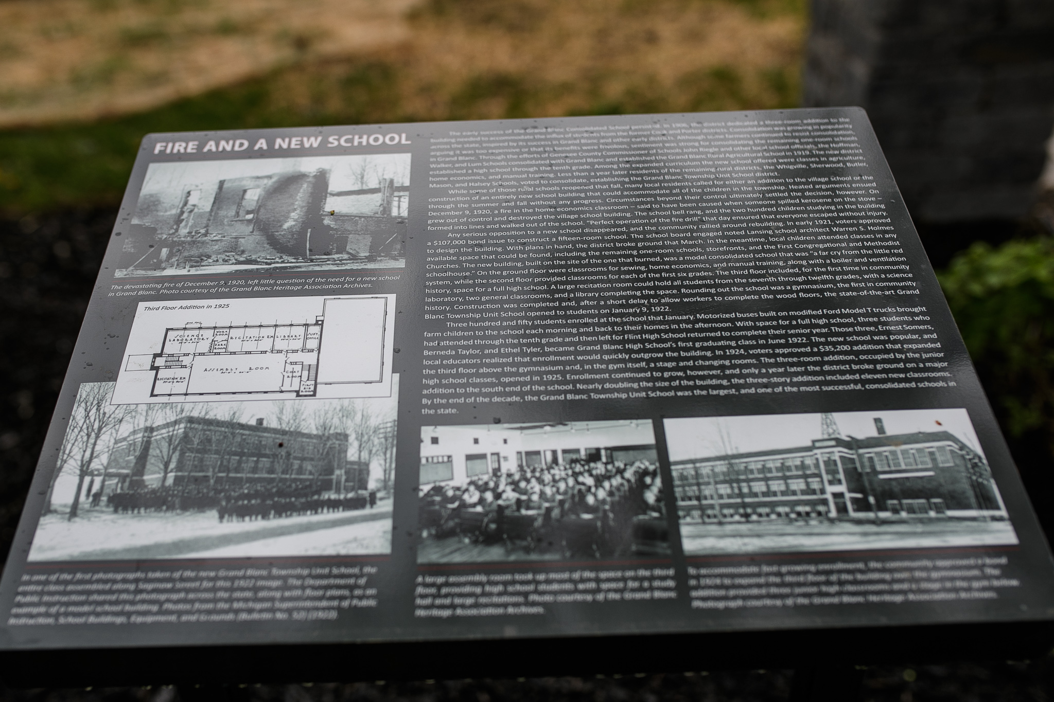 Historic informative plaques line the area that the new Perry Centennial Pavilion sits during the Perry Center Centennial Event in Grand Blanc on Saturday, May 14, 2022. (Jenifer Veloso | MLive.com)