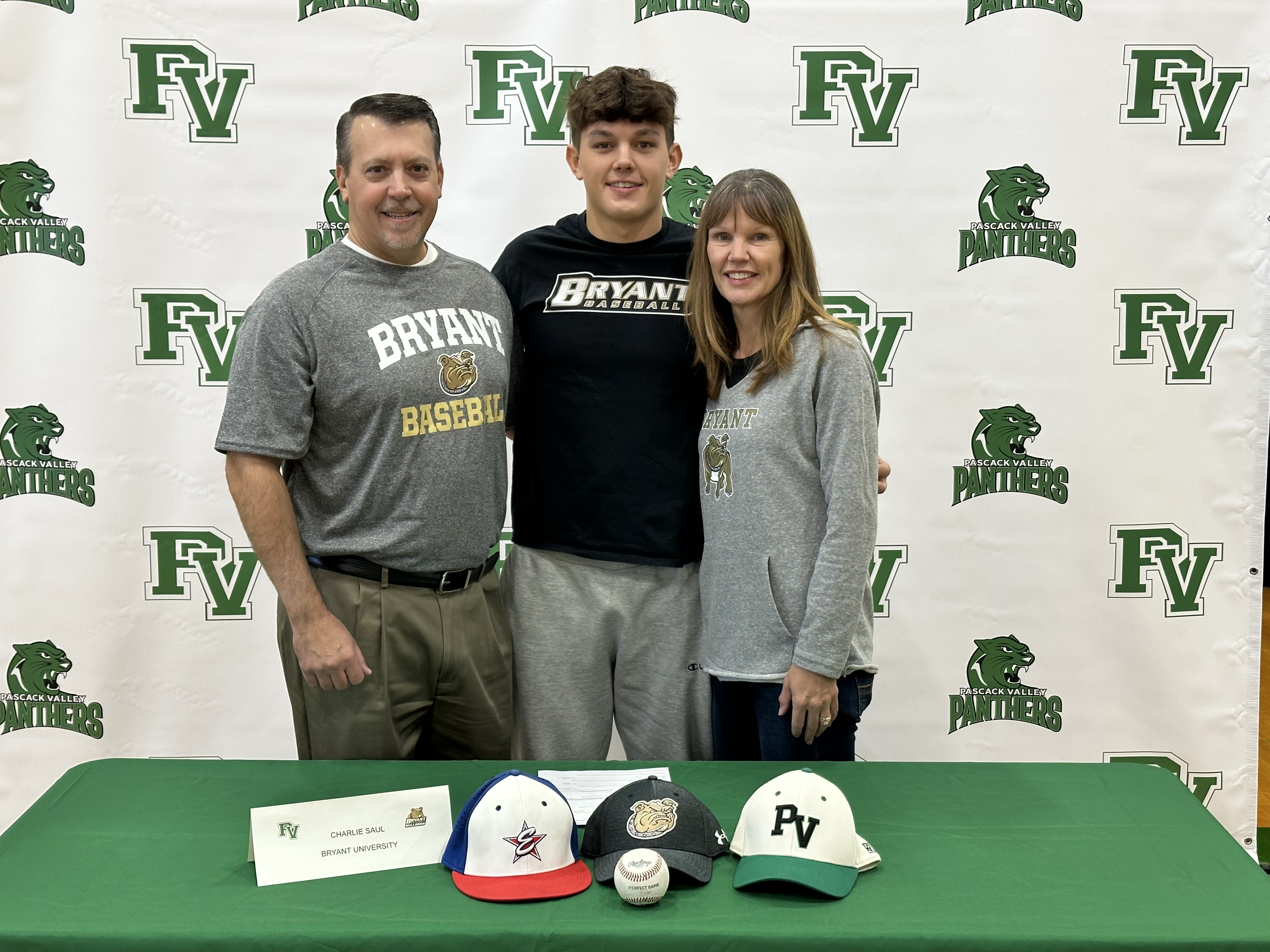 Pascack Valley's Charlie Saul signs with Bryant baseball alongside his parents, Andrea Wolff and Kevin Saul