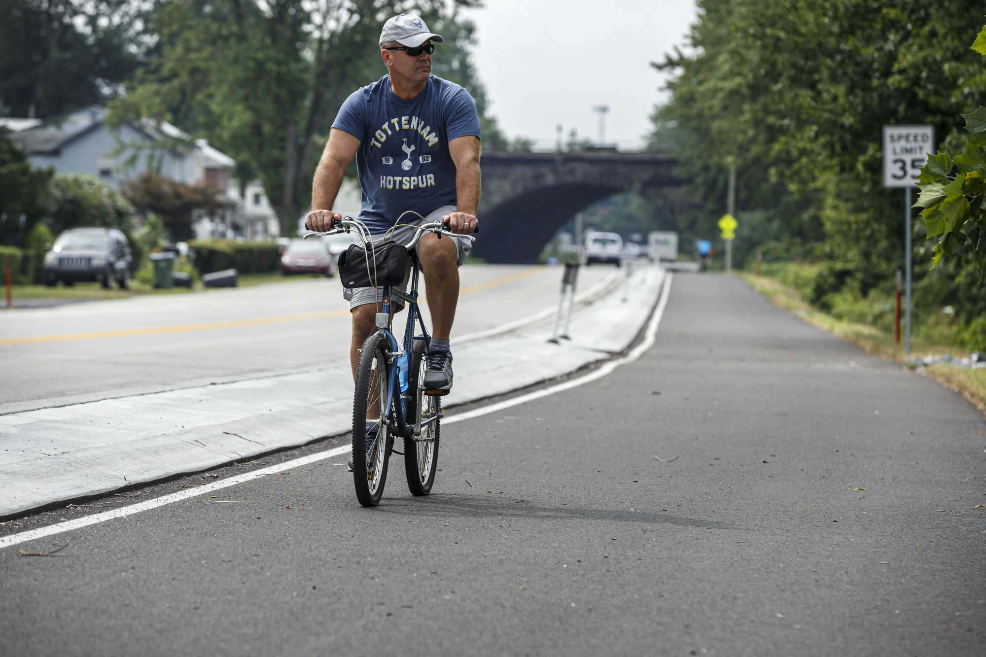 A bicyclist rides the Greenbelt trail extension along North Front Street near Fort Hunter Park. The Capital Area Greenbelt Fort Hunter 2-mile connector has been finished. The extension connects the 20-mile Greenbelt between Fort Hunter Park and the northernmost part of the Greenbelt at Lingletstown Road at Wildwood Park.July 17, 2020. Dan Gleiter | dgleiter@pennlive.com