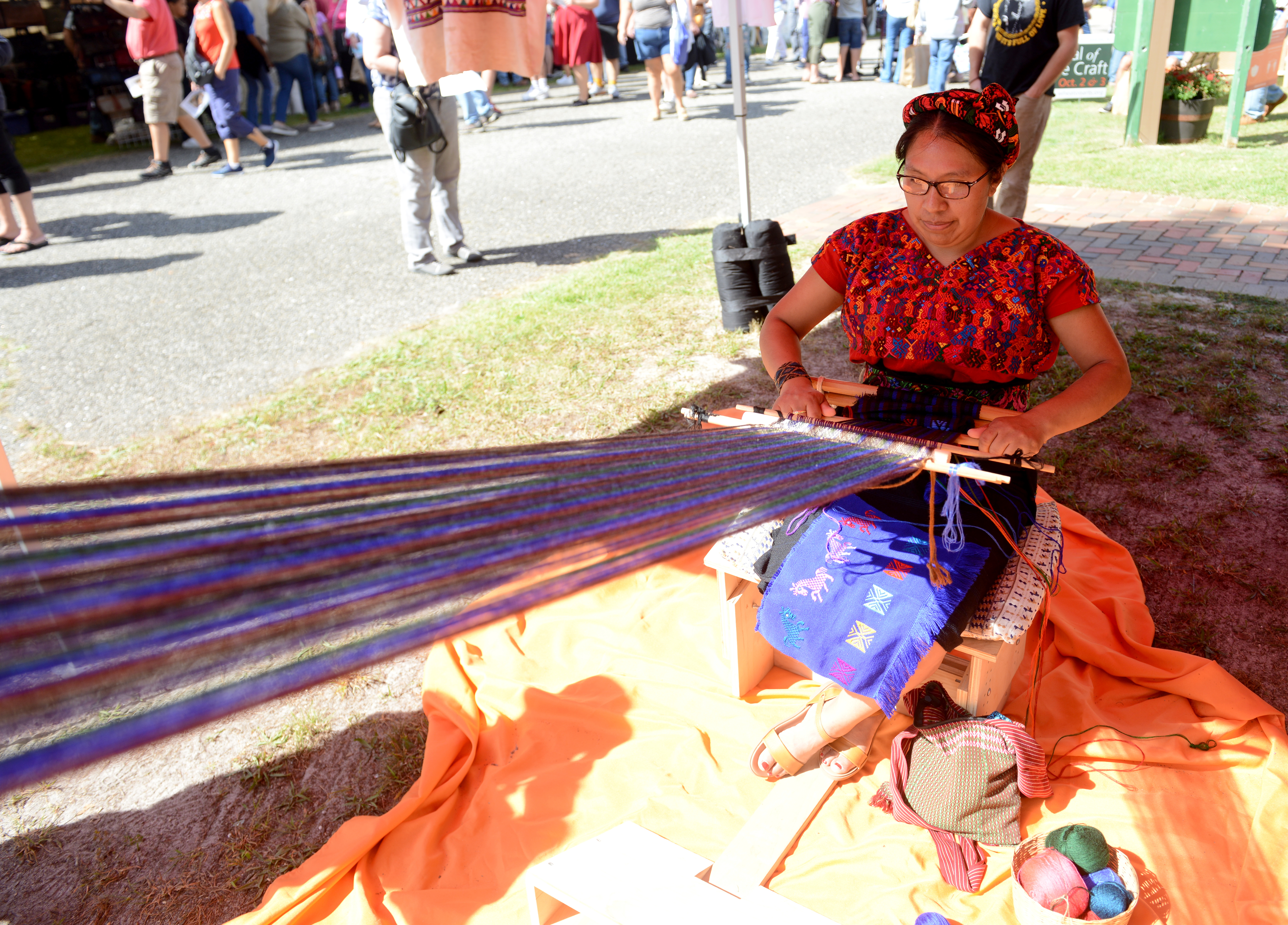Guatemalan master weaver Angélica López demonstrates a backstop loom technique during the 22nd annual Festival of Fine Craft at Wheaton Arts in Millville, Saturday, Oct. 2, 2021.