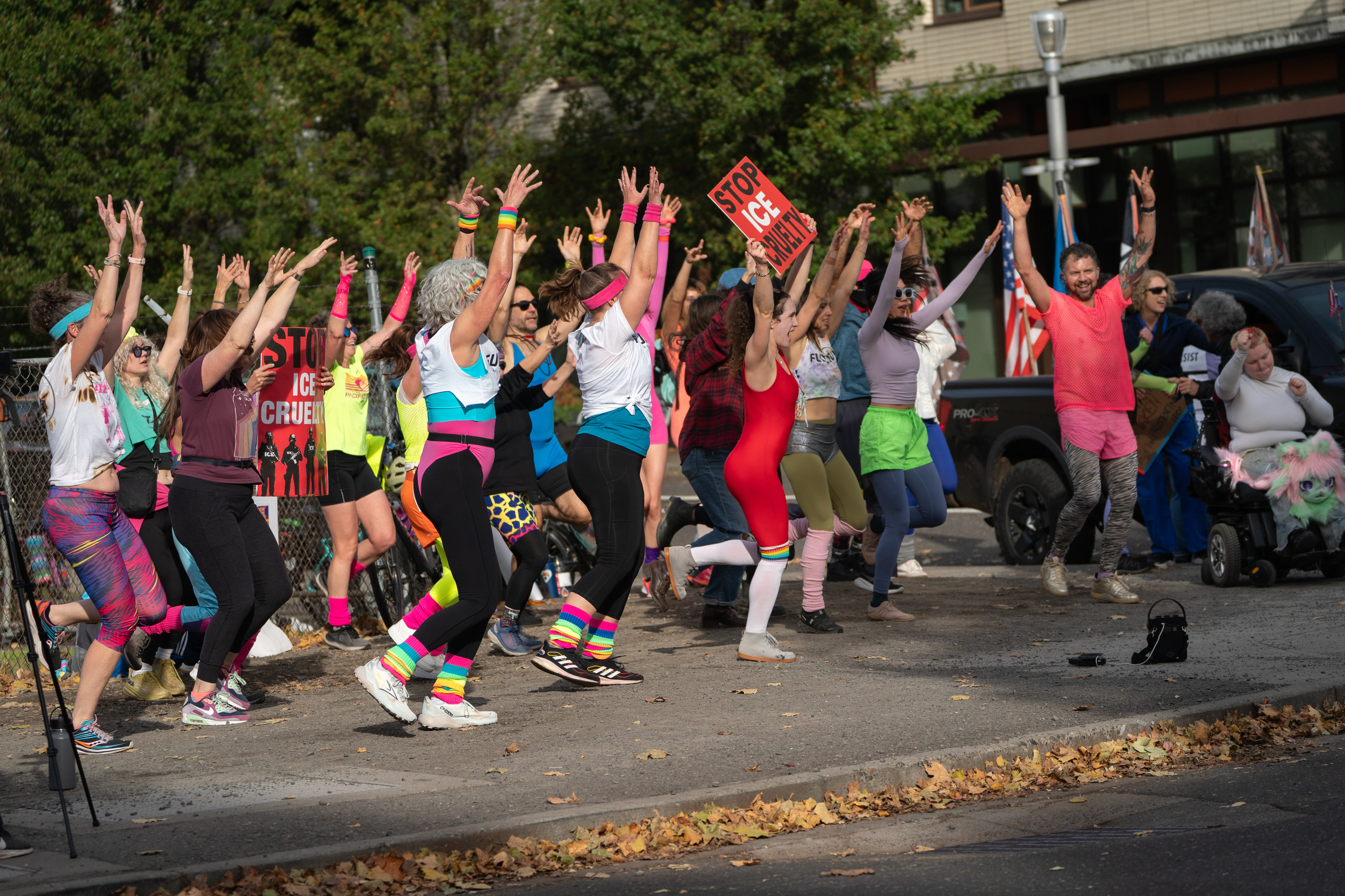 Participants in Fulcrum Fitness’s “Sweatin’ Out the Fascists” held an ’80s-aerobics peaceful protest outside the U.S. Immigration and Customs Enforcement (ICE) facility in South Portland on Sunday, Nov. 9, 2025, collecting donations for the Oregon Food Bank.