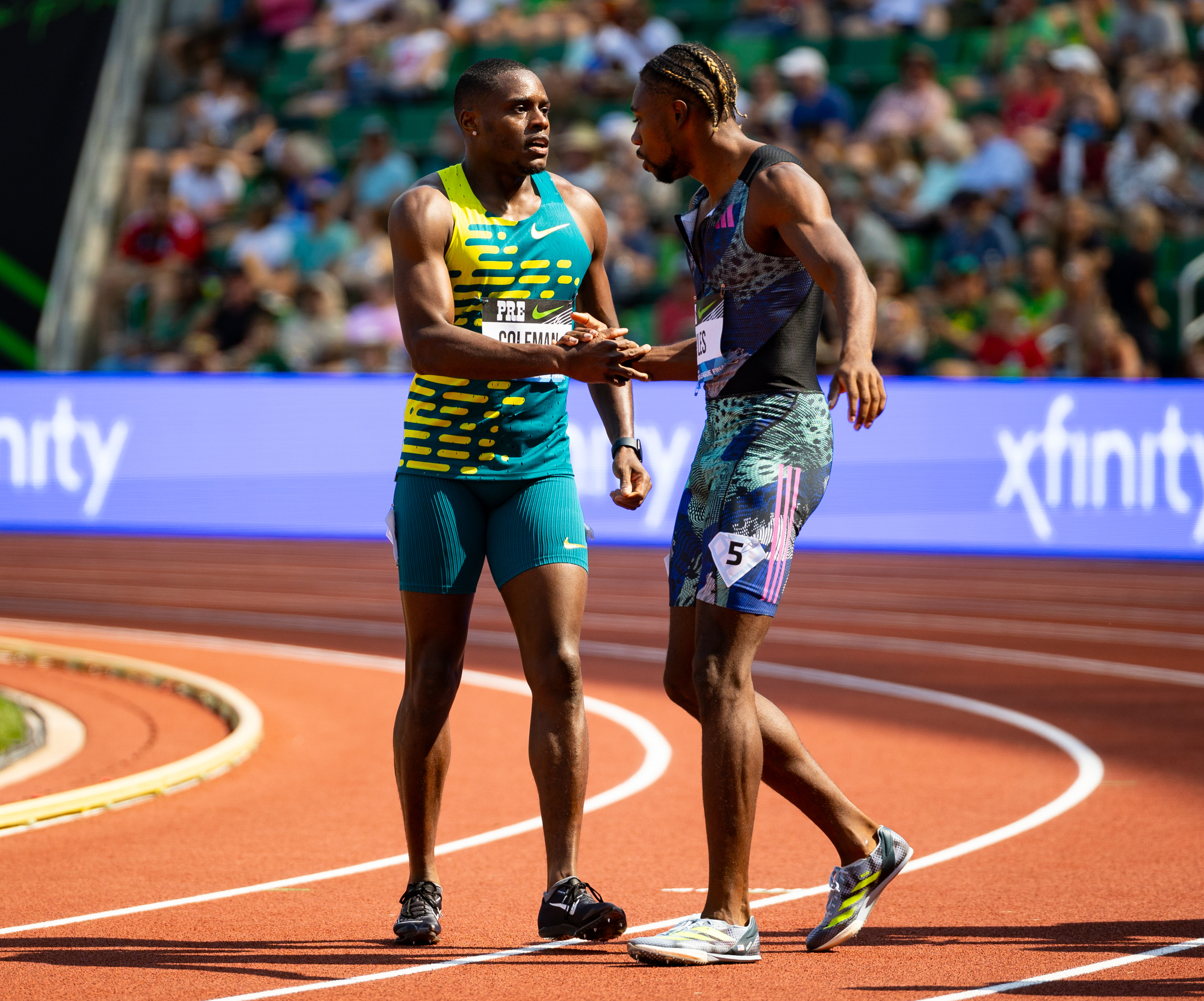 Christian Coleman (left) of the United States shakes hands with Noah Lyles of the U.S. after Coleman beat Lyles in the men’s 100 meters at the Prefontaine Classic track and field meet on Saturday, Sept. 16, 2023, at Hayward Field in Eugene.