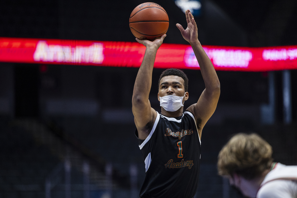 Photos of Detroit Douglass basketball player Pierre Brooks II