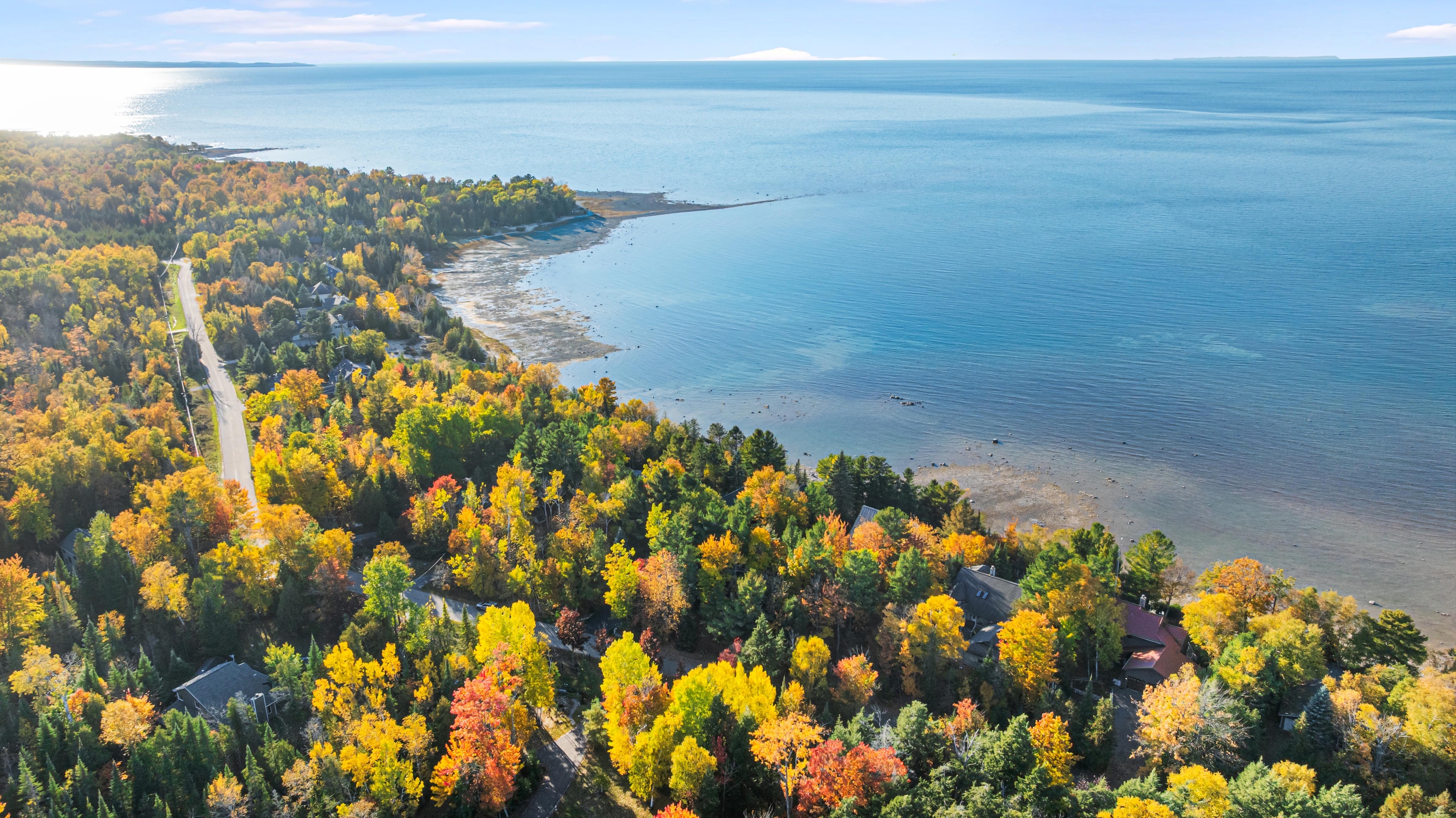 Aerial photographs of 4093 Lake Shore Drive in Charlevoix, this gem is listed at $2,099,900 through Berkshire Hathaway HomeServices Michigan Real Estate – Traverse City and The Crane Group with associate broker Johnny Crane and his brother, co-listing agent Matt Crane.