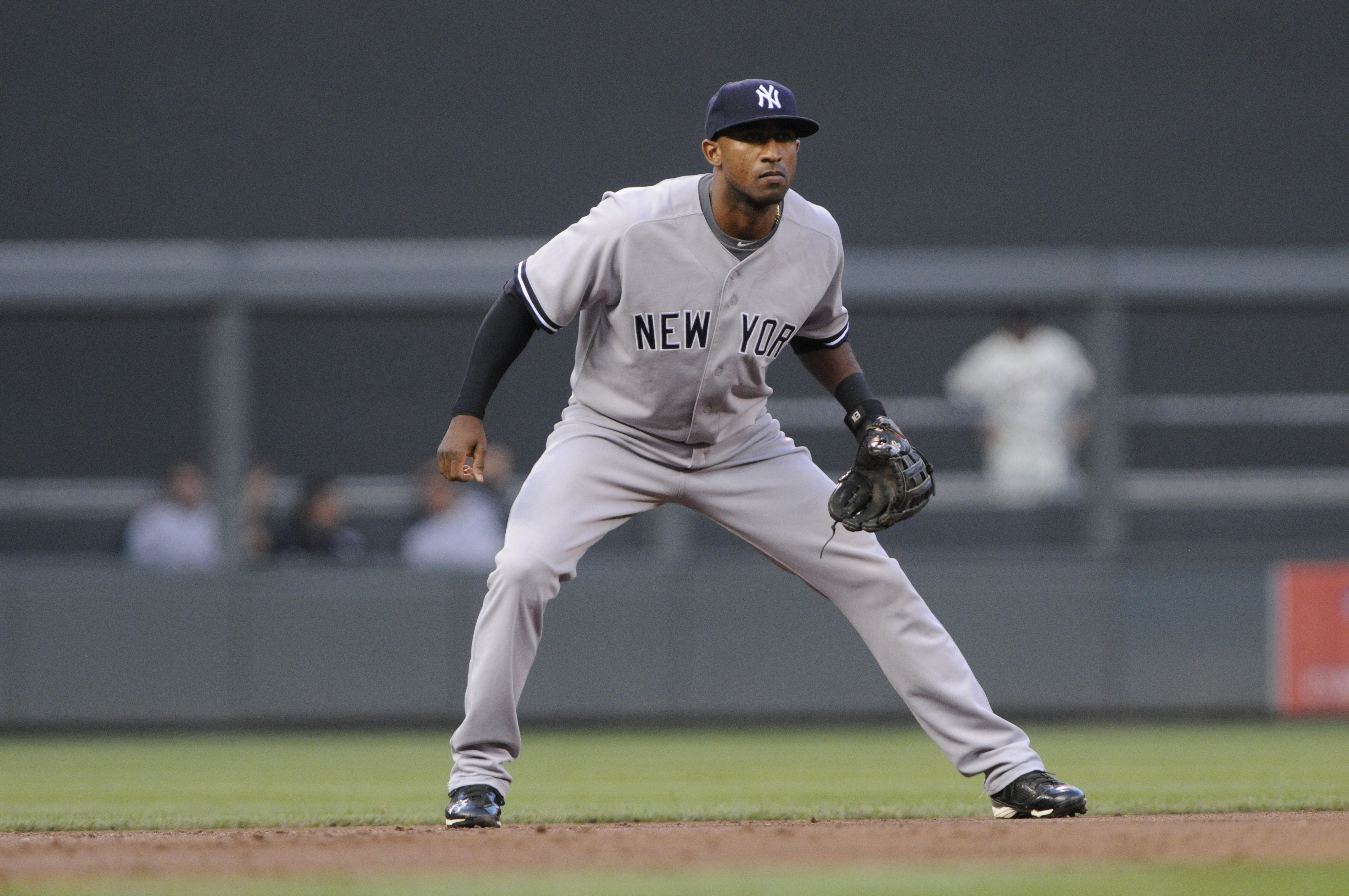 Ex-Yankees infielder, clinging to roster spot, tries new position