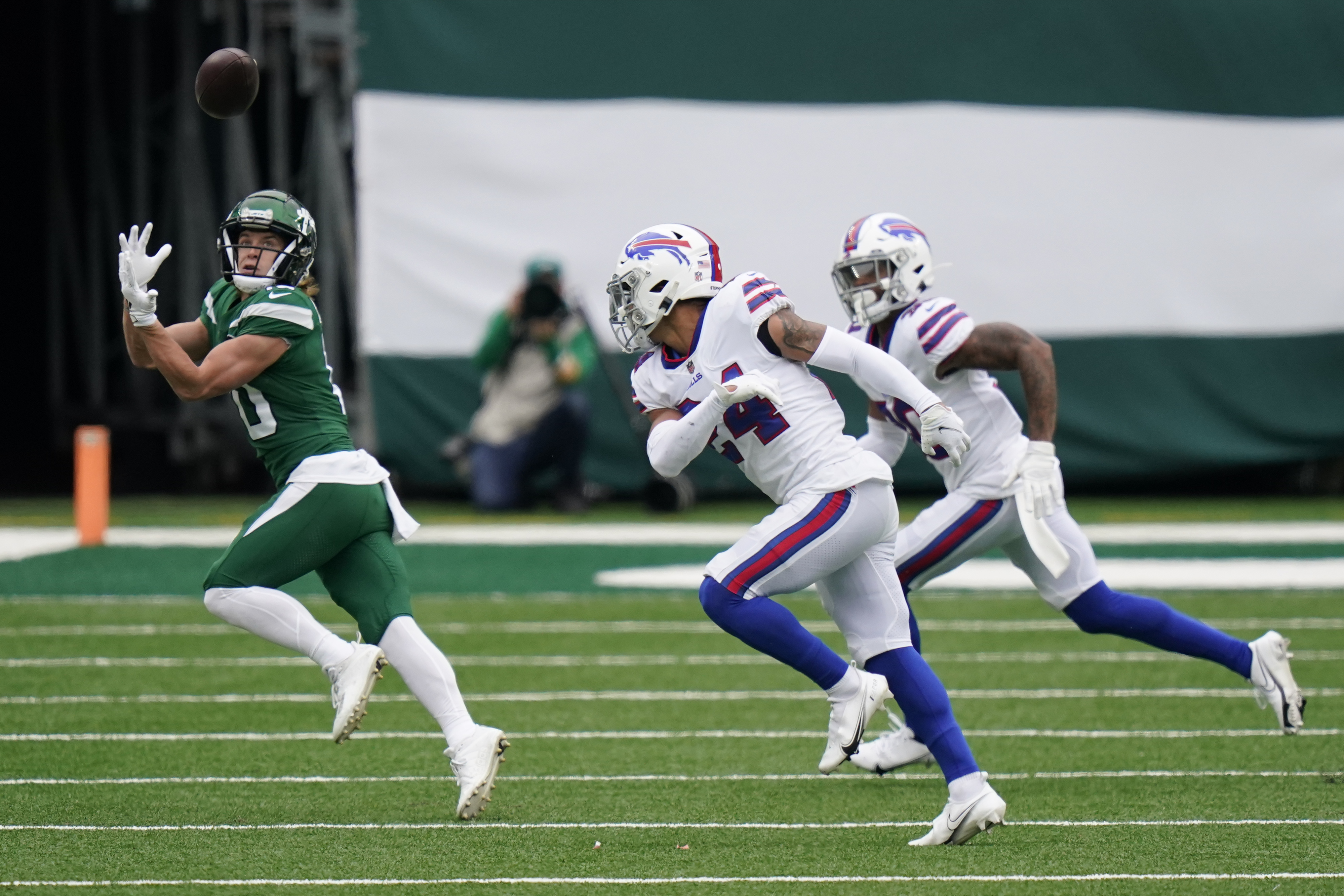 New York Jets' Blessuan Austin, bottom, breaks up a pass intended for  Buffalo Bills' Gabriel Davis, top, during the first half of an NFL football  game, Sunday, Oct. 25, 2020, in East