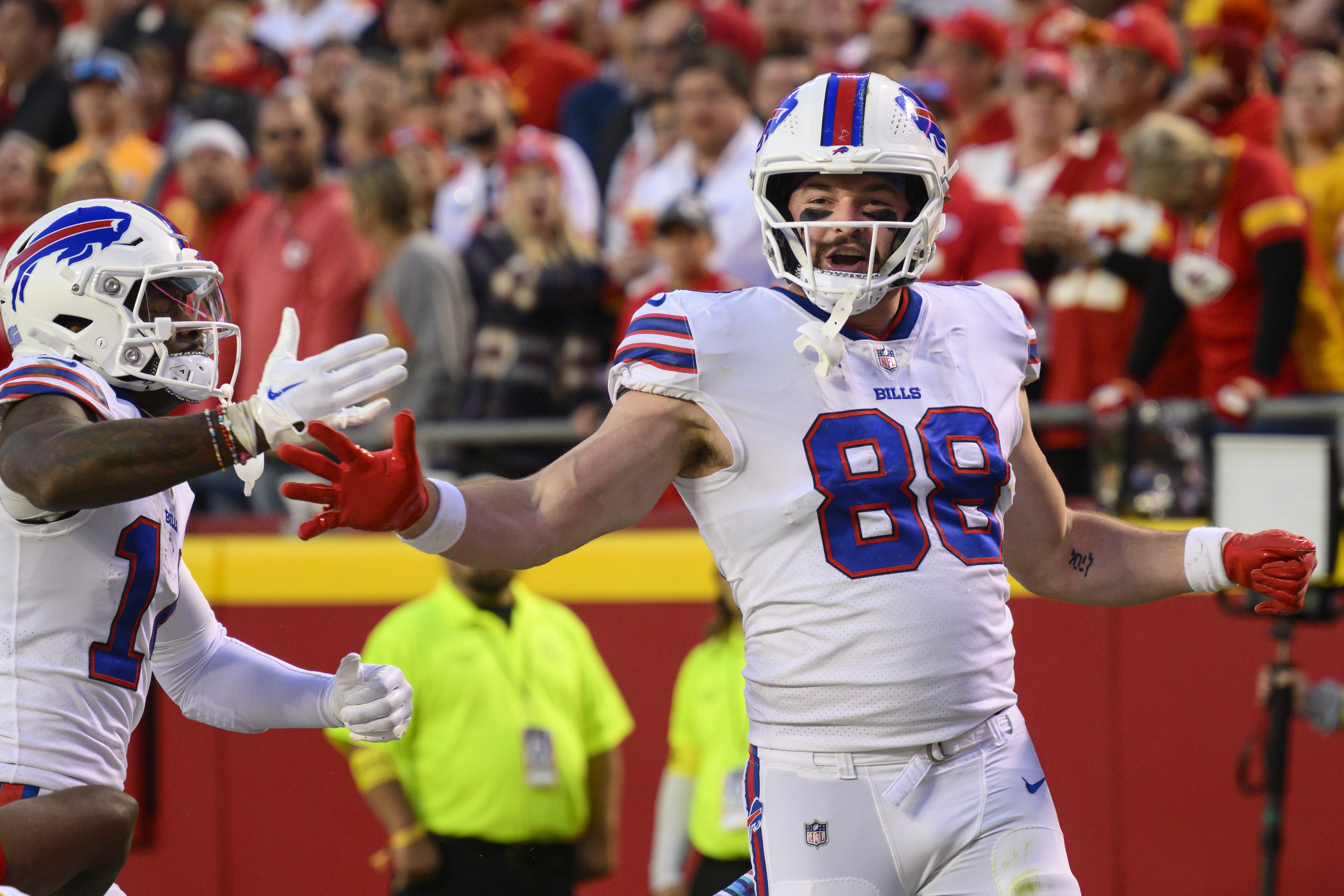 Buffalo Bills tight end Dawson Knox (88) is congratulated by teammates  after scoring during the …