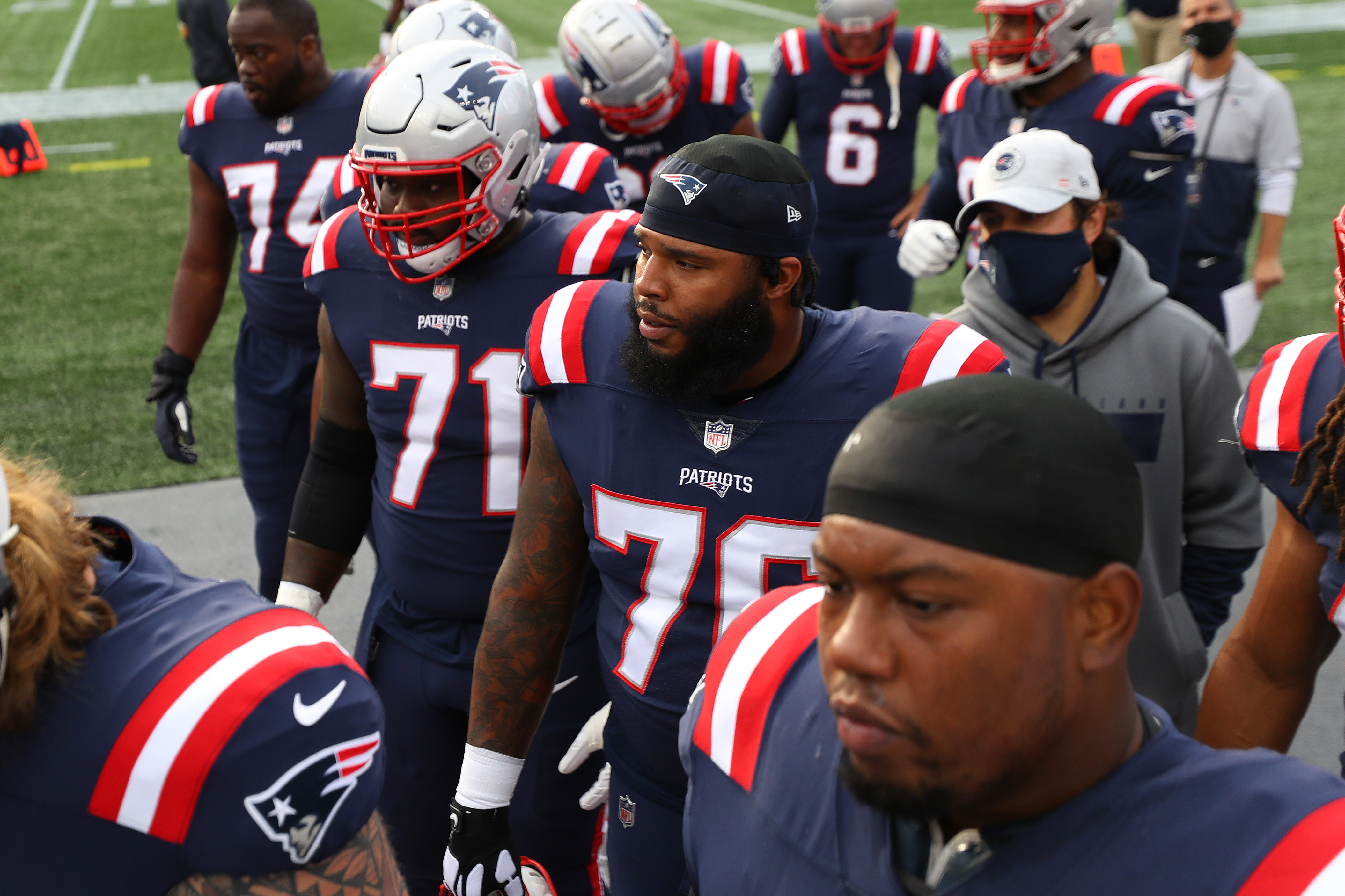 Patriots place OLs Isaiah Wynn, Michael Onwenu on COVID list