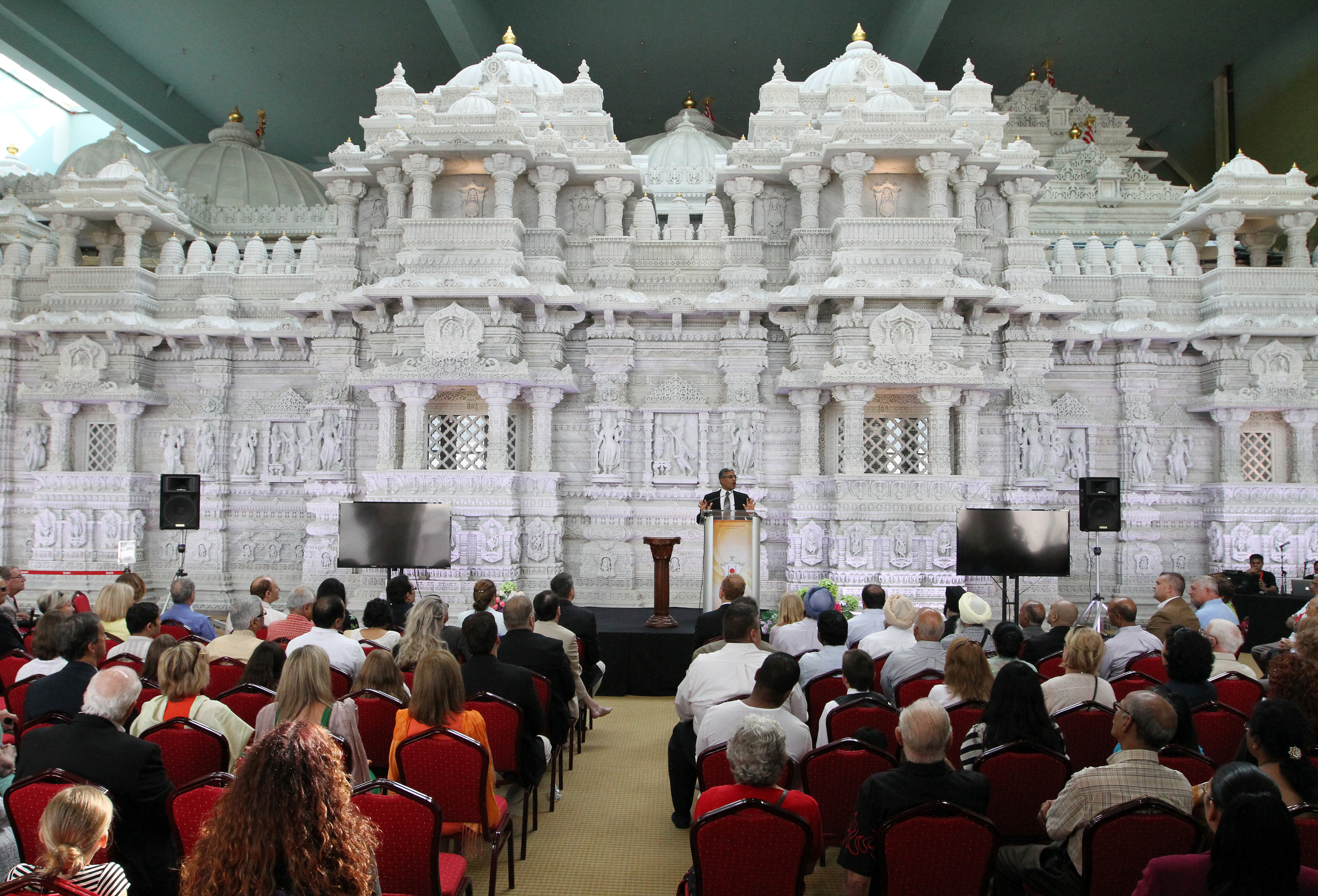 Kanu Patel, chief executive officer, speaks to during a ceremony dedicating the new BAPS Shri Swaminarayan Mandir temple, in Robbinsville, August 16, 2014.