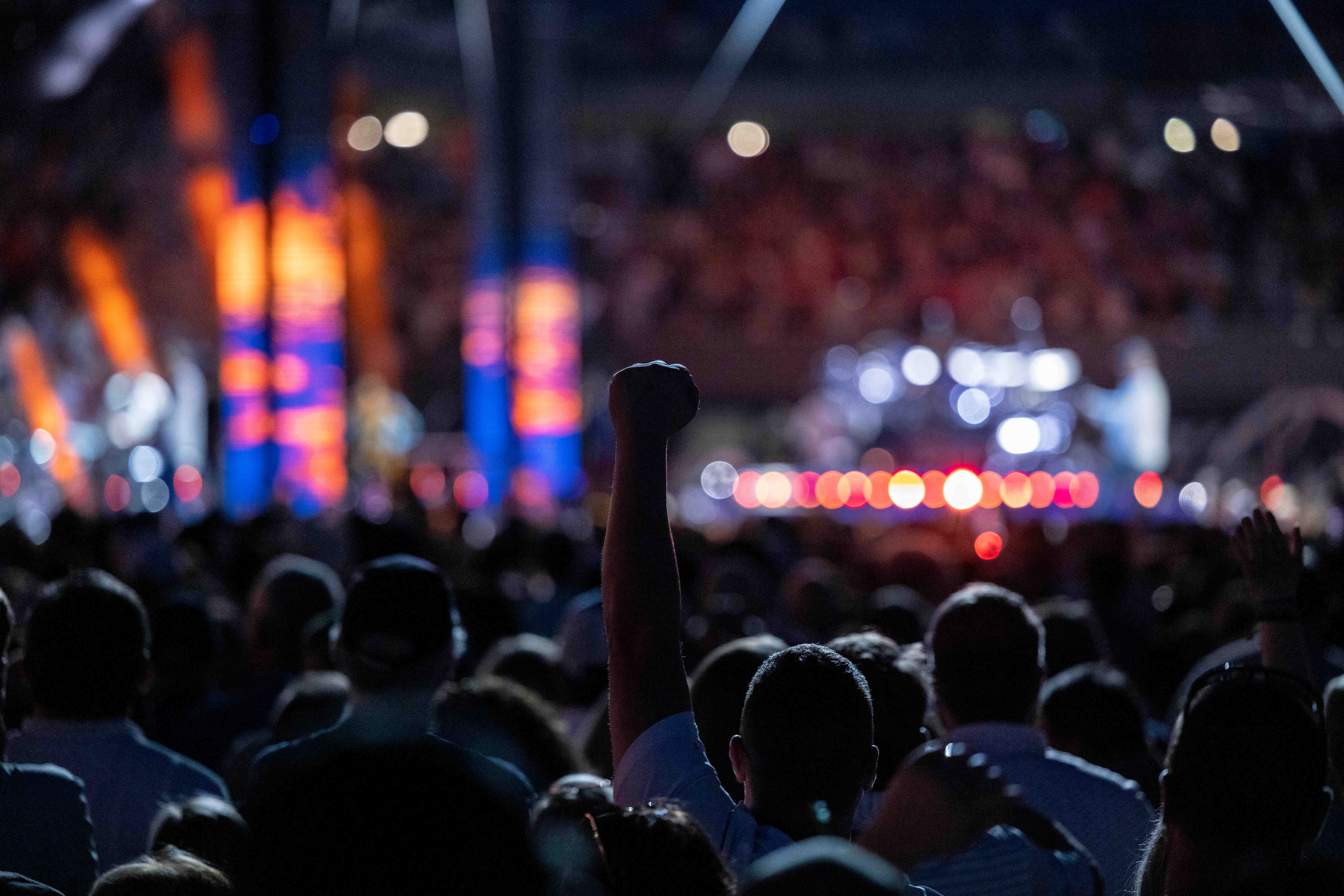 2025 Rolling Stones concert poster with energetic crowd cheering