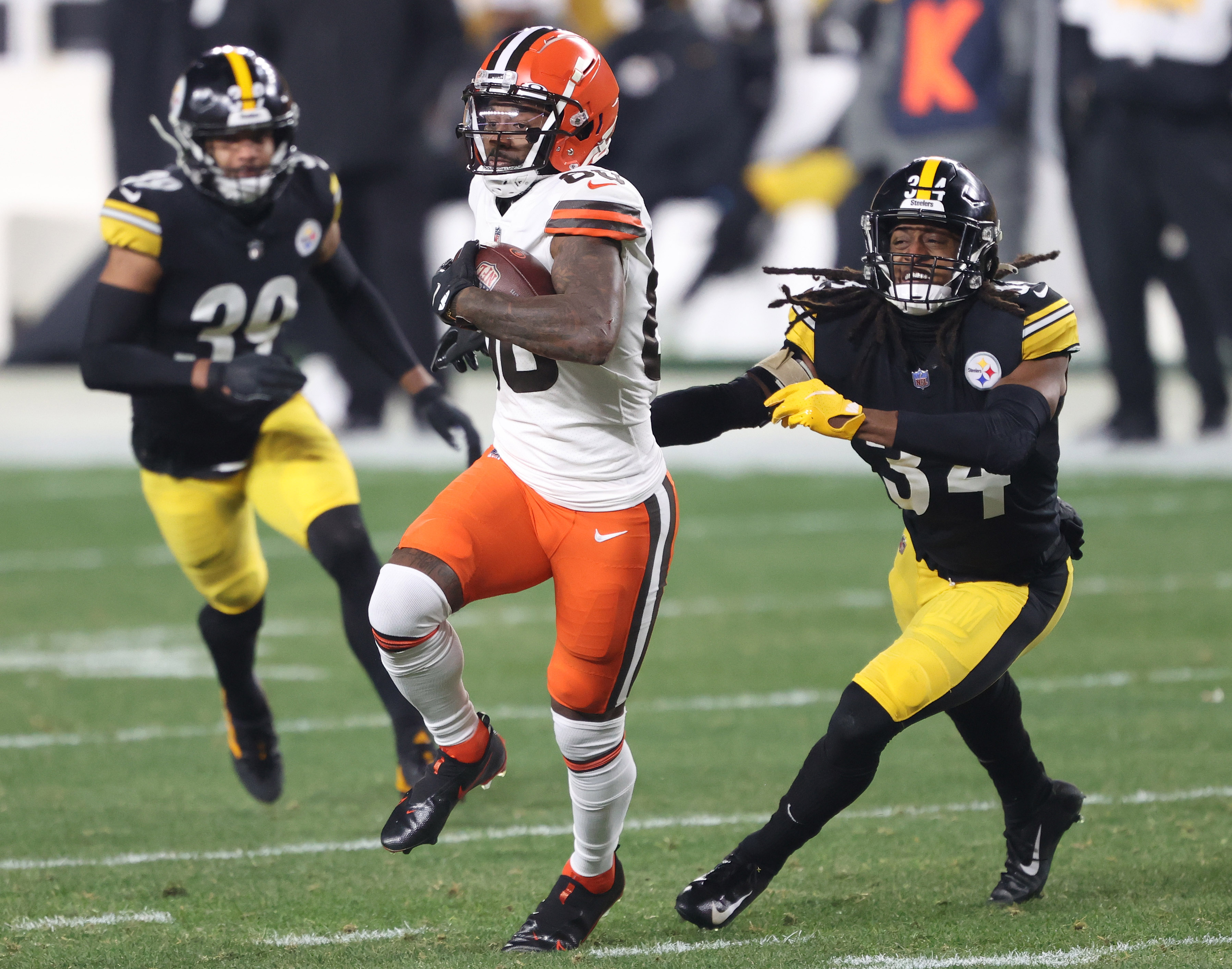 Pittsburgh Steelers free safety Minkah Fitzpatrick (39) celebrates with  wide receiver JuJu Smith-Schuster (19) on the sideline after scoring a  touchdown on an intercepted pass from Cleveland Browns quarterback Baker  Mayfield during