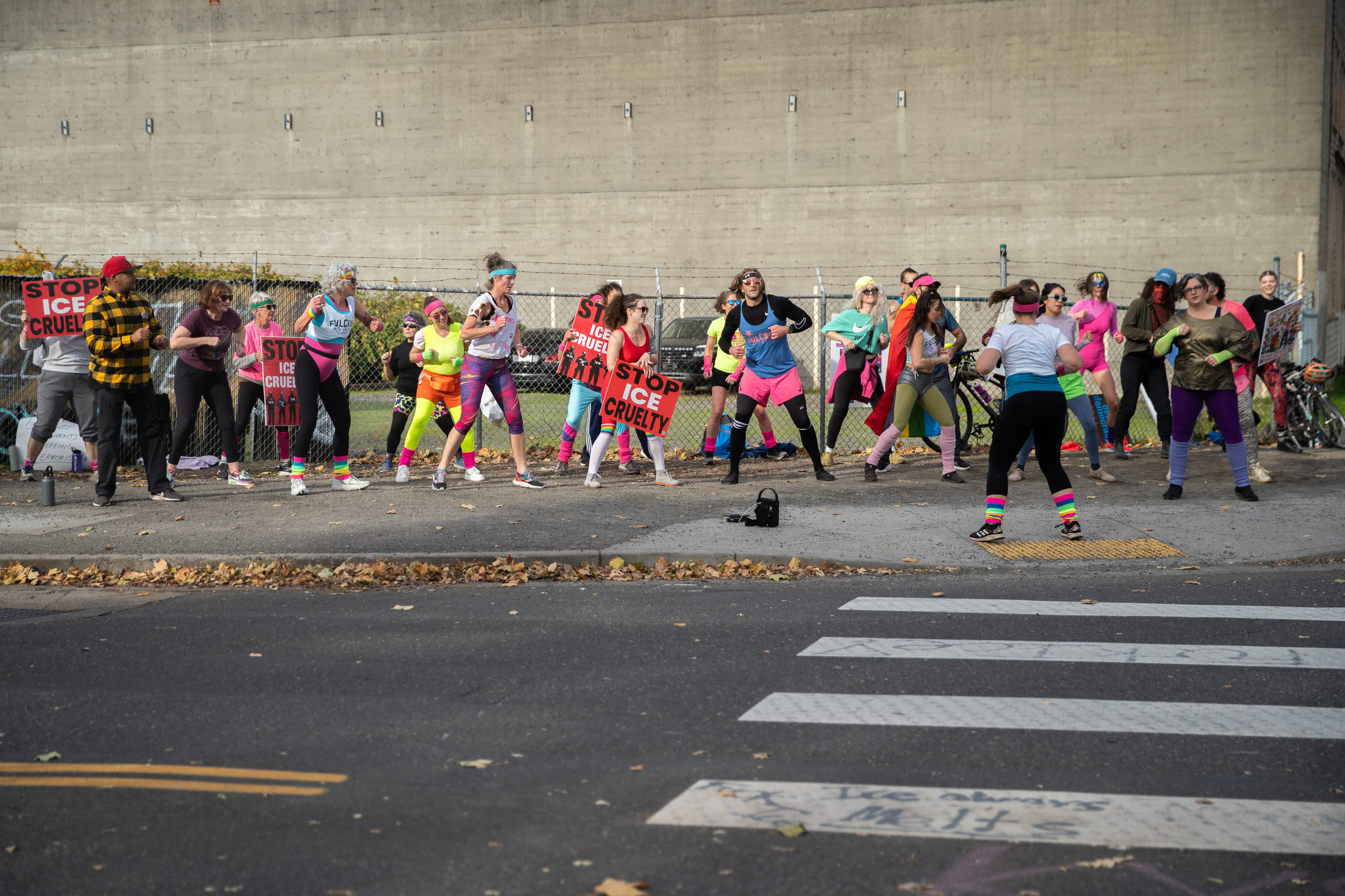 Participants in Fulcrum Fitness’s “Sweatin’ Out the Fascists” held an ’80s-aerobics peaceful protest outside the U.S. Immigration and Customs Enforcement (ICE) facility in South Portland on Sunday, Nov. 9, 2025, collecting donations for the Oregon Food Bank.