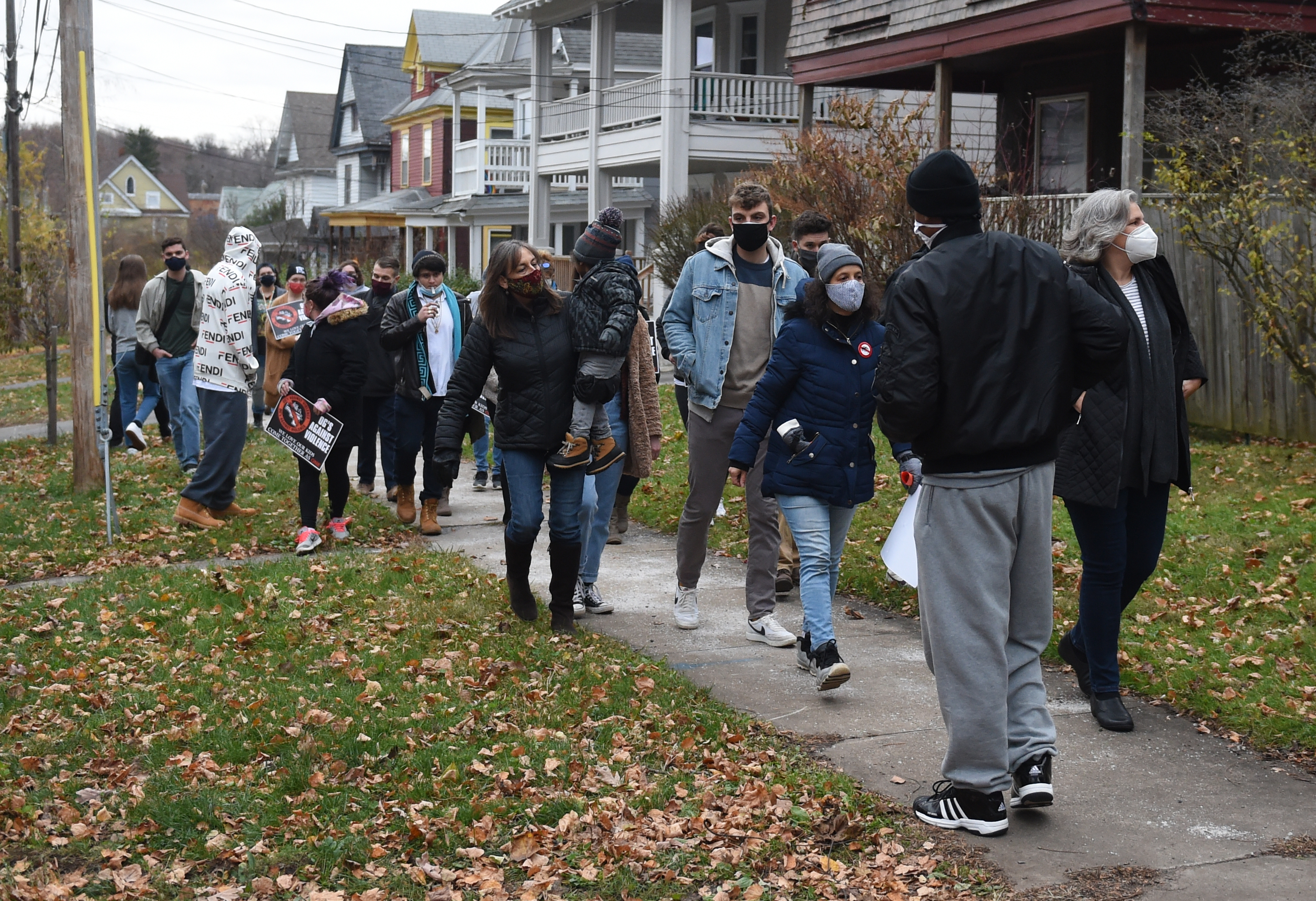 Friends and family march through Westcott from Jerry Murray's murder scene on Judson Street to gather at his mothers home on Trinity Place, Syracuse, N.Y., Saturday, November 21, 2020.