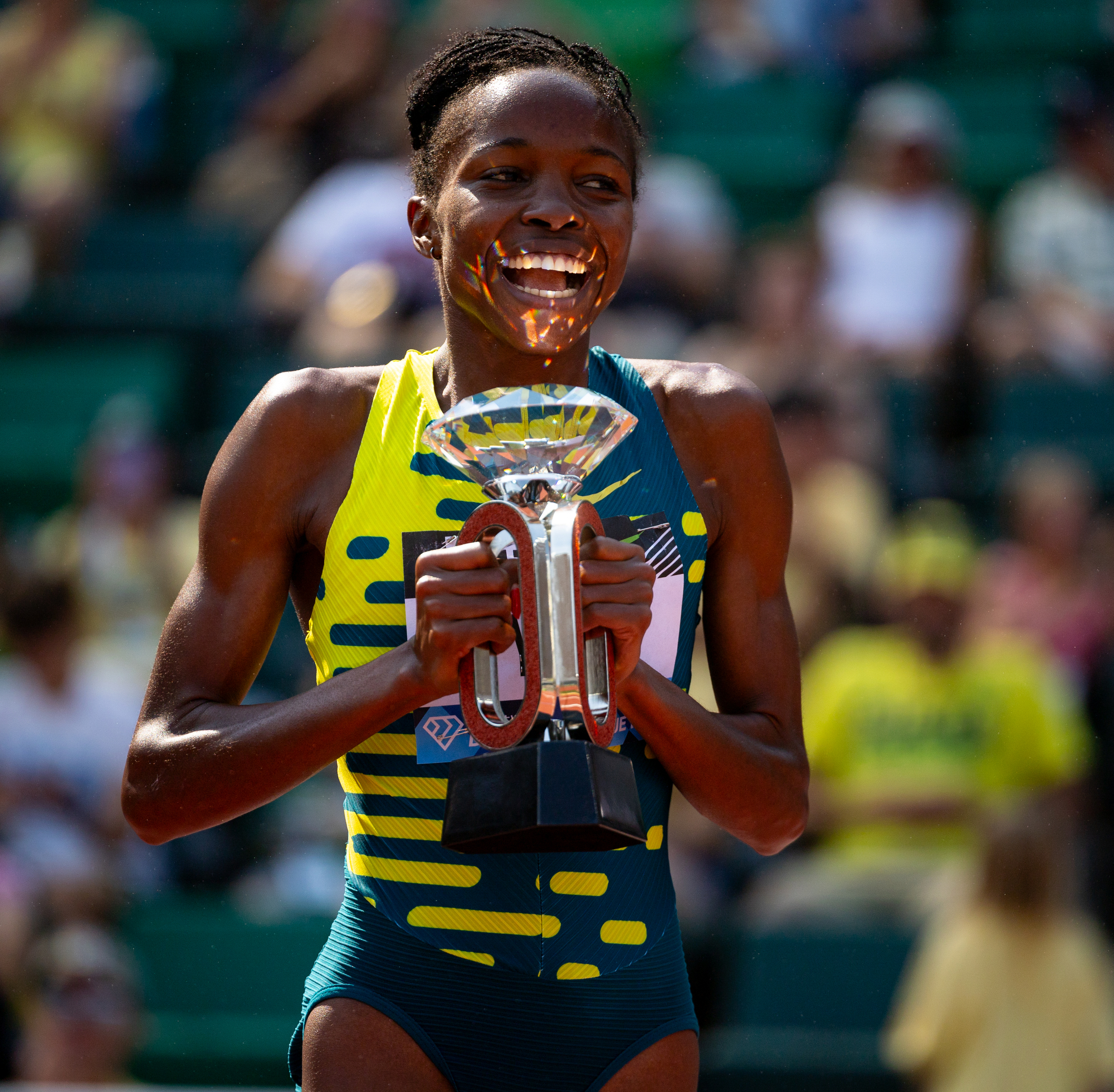 Winfred Mutile Yavi of Bahrain celebrates with the Diamond League trophy after winning the women's steeplechase at the Prefontaine Classic track and field meet on Saturday, Sept. 16, 2023, at Hayward Field in Eugene.