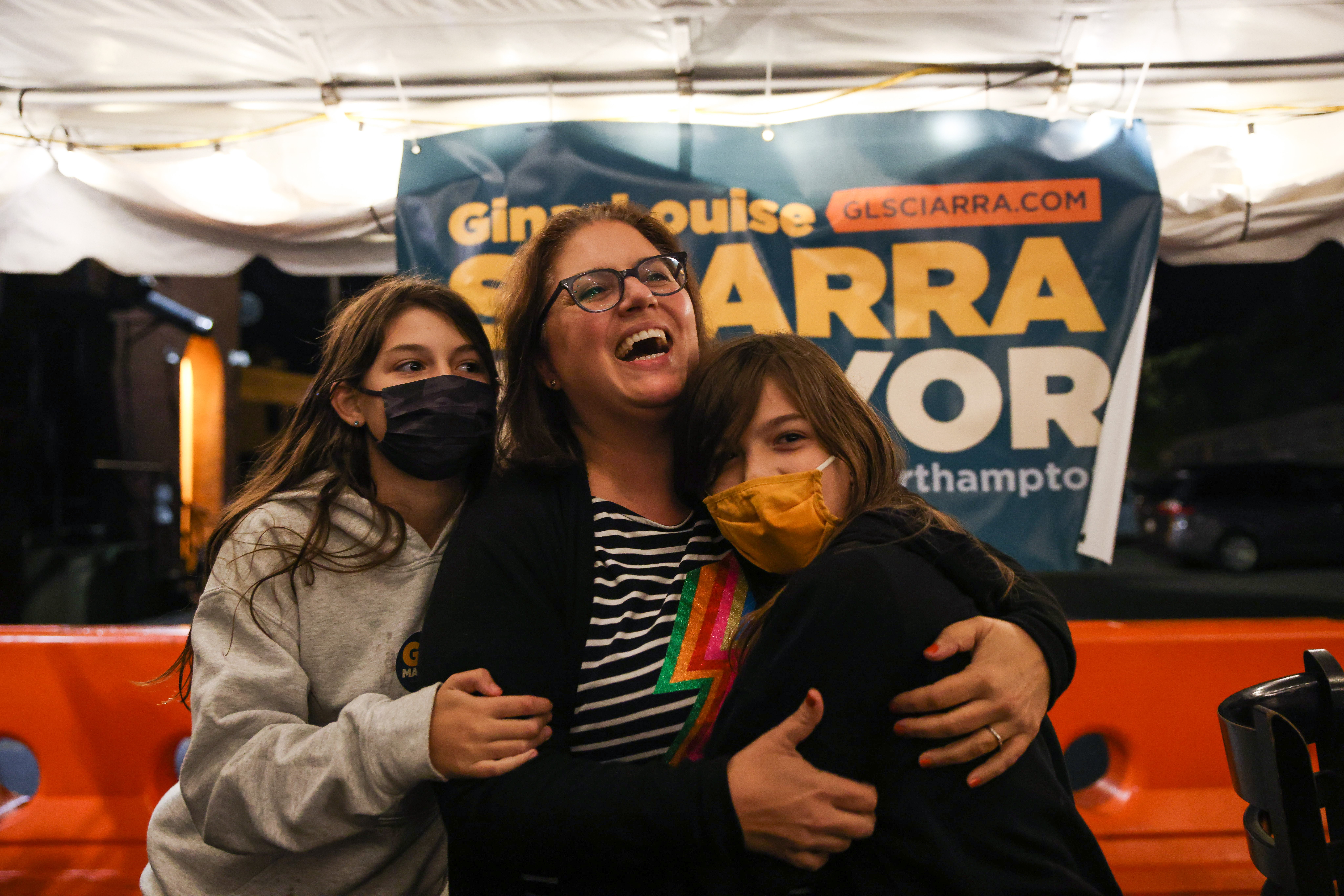 Mayoral candidate Gina-Louise Sciarra, center, celebrates her first-place finish in the Northampton preliminary election Sept. 28, 2021, at Fitzwilly's restaurant.
With her are daughters Alazne Scher, 12, Simone Scher, 9. (Hoang 'Leon' Nguyen / The Republican)
