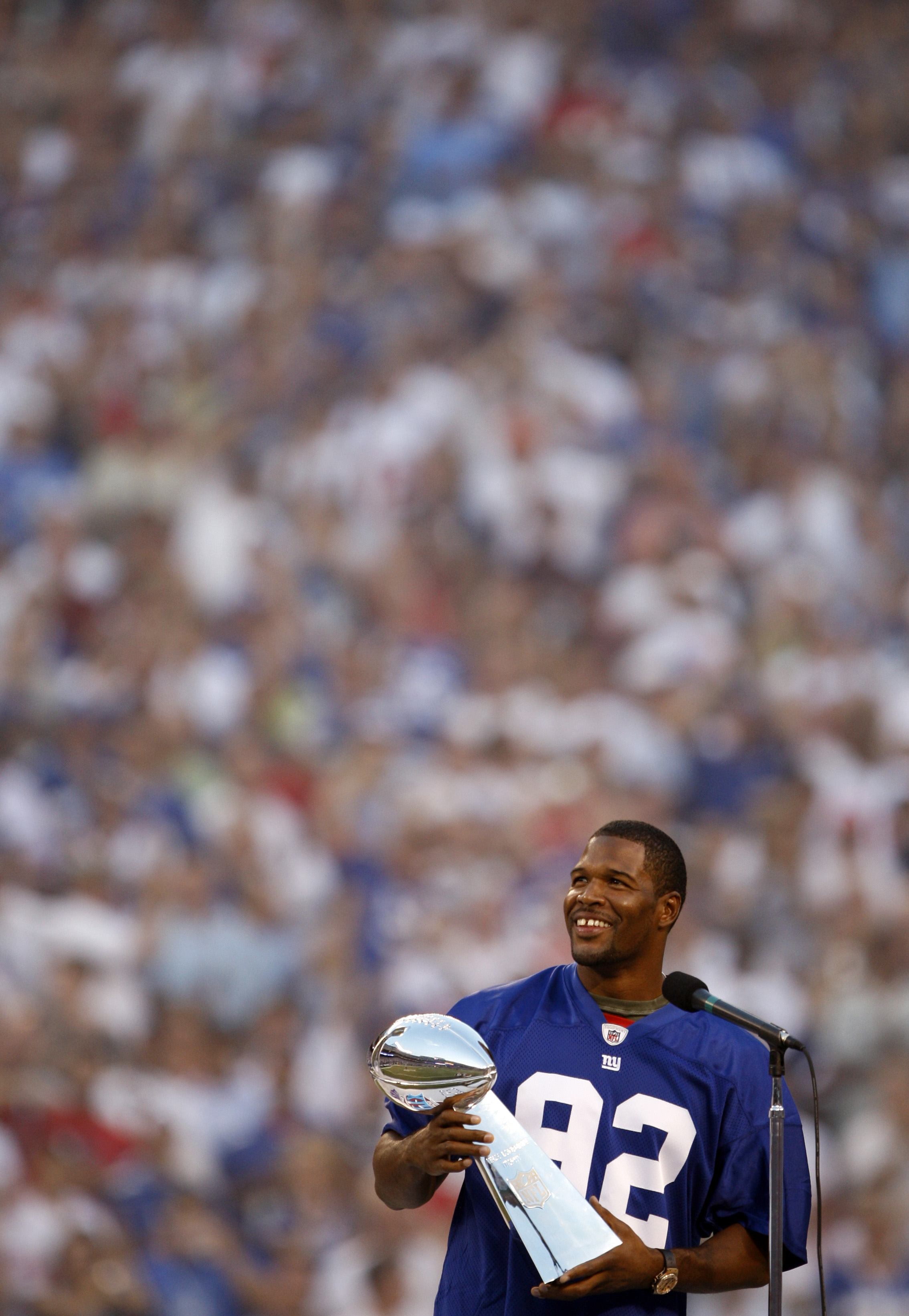 Michael Strahan with the Vince Lombardi Trophy during pregame Super Bowl celebration as the New York Giants host the Washington Redskins in the NFL 2008 season opener at Giants Stadium. EAST RUTHERFORD, NJ  (2008 file photo by Andrew Mills | The Star-Ledger)