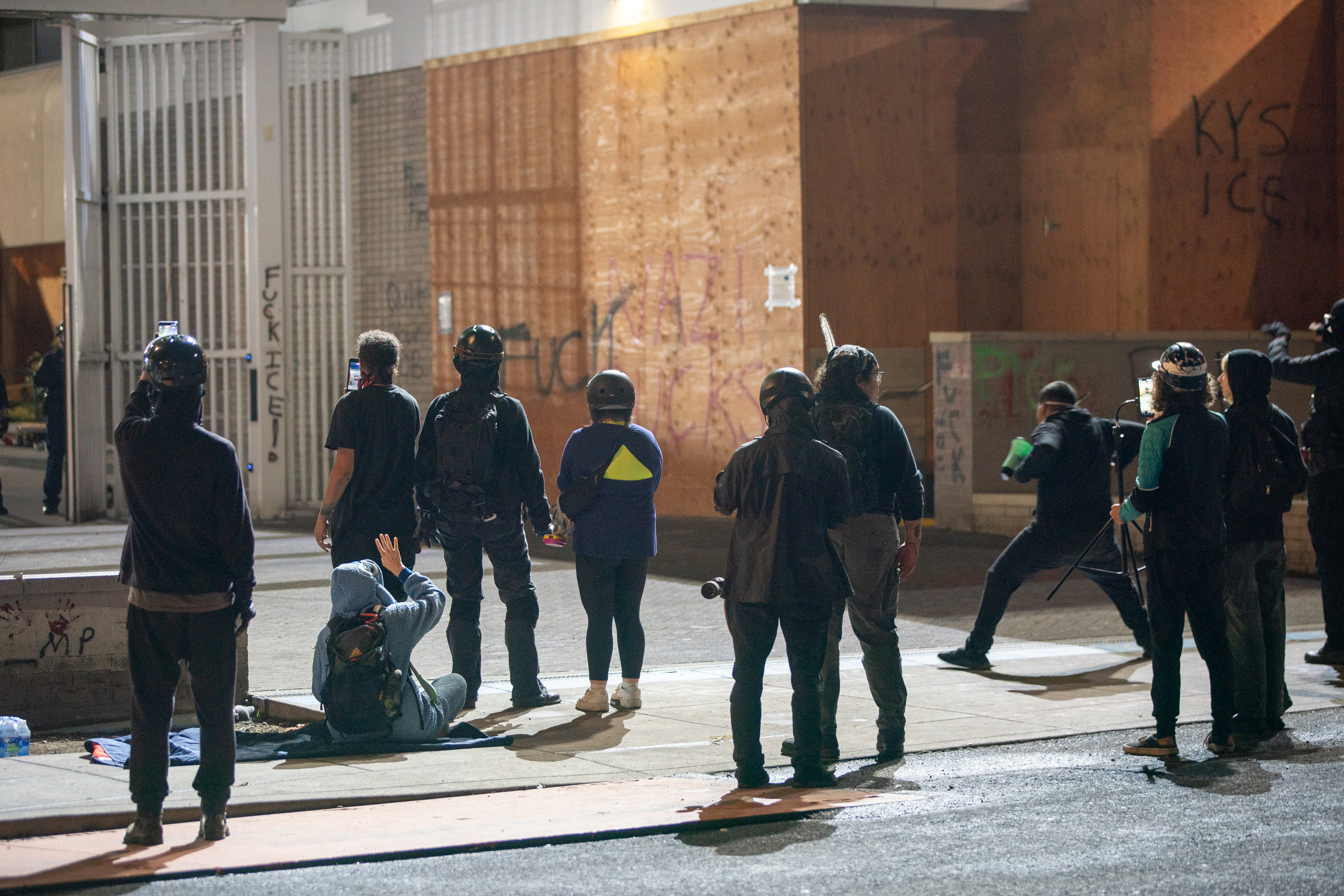 Protesters gather outside the boarded-up U.S. Immigration and Customs Enforcement building in South Portland on Monday, Sept. 8, 2025, days after President Donald Trump suggested federal intervention.