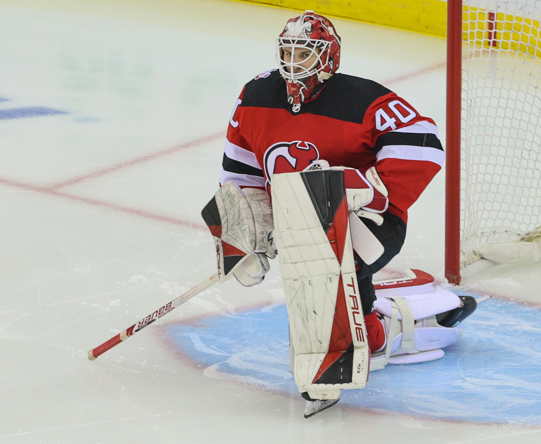 New Jersey Devils goaltender Akira Schmid (40) makes a save against the  Tampa Bay Lightning during the first period of an NHL hockey game Thursday,  March 16, 2023, in Newark, N.J. (AP