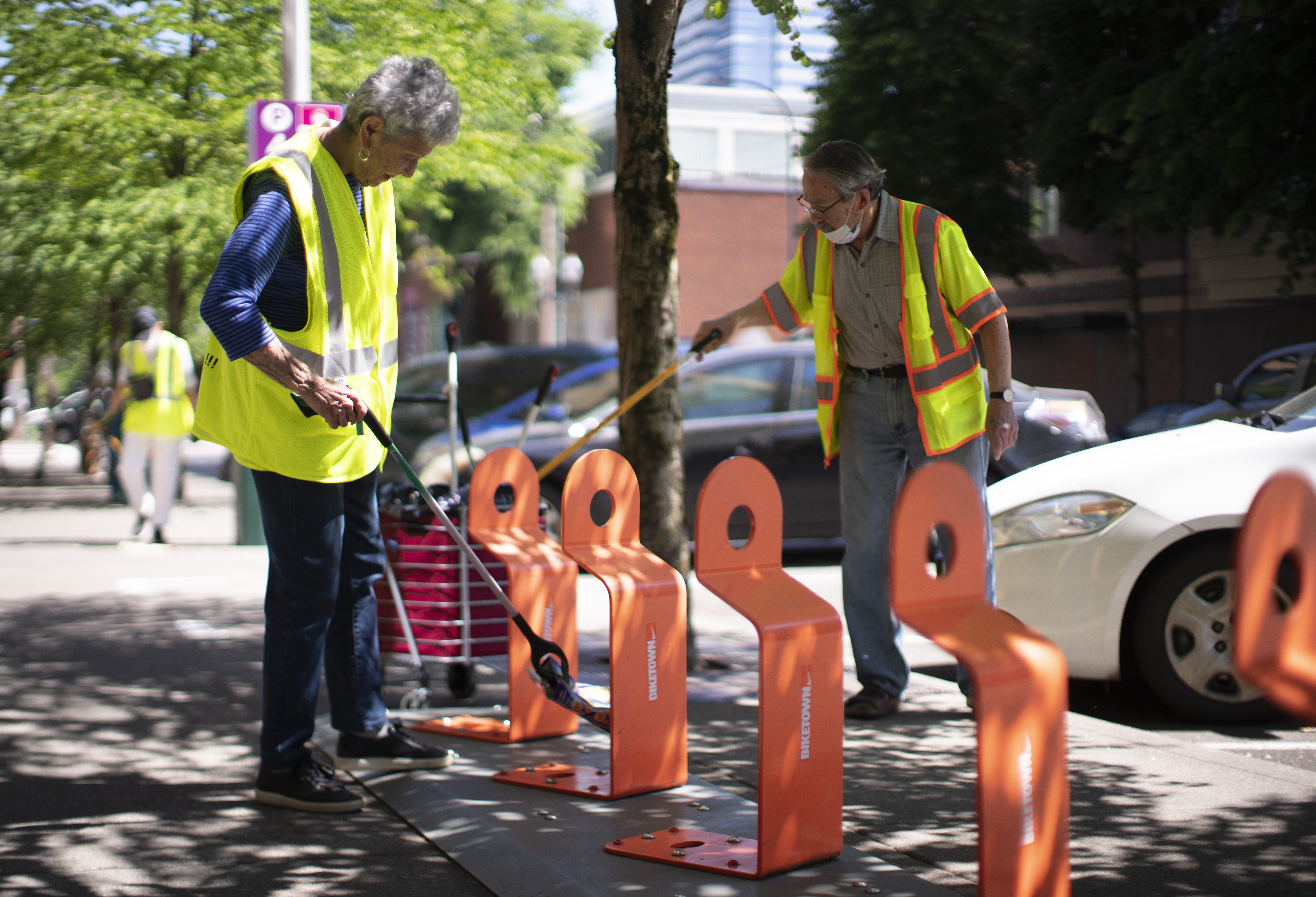 Downtown Neighborhood Association members clean up trash in downtown ...