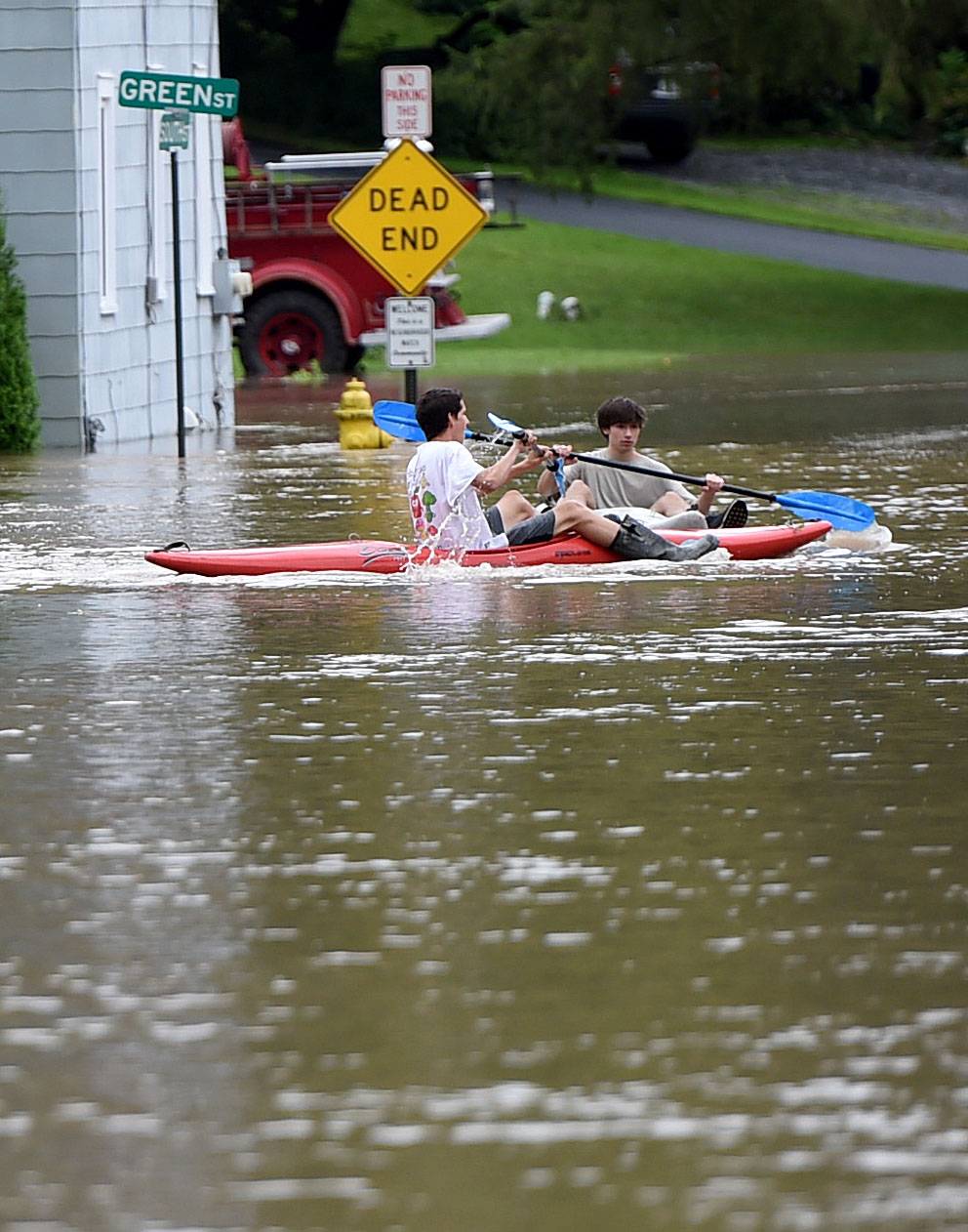 Kayakers take advantage of the flooding on South Street in Camillus August 19, 2021. Heavy rains again created flooding in Central New York with much of the flooding occurring along Ninemile Creek in Camillus and Marcellus. Dennis Nett | dnett@syracuse.com