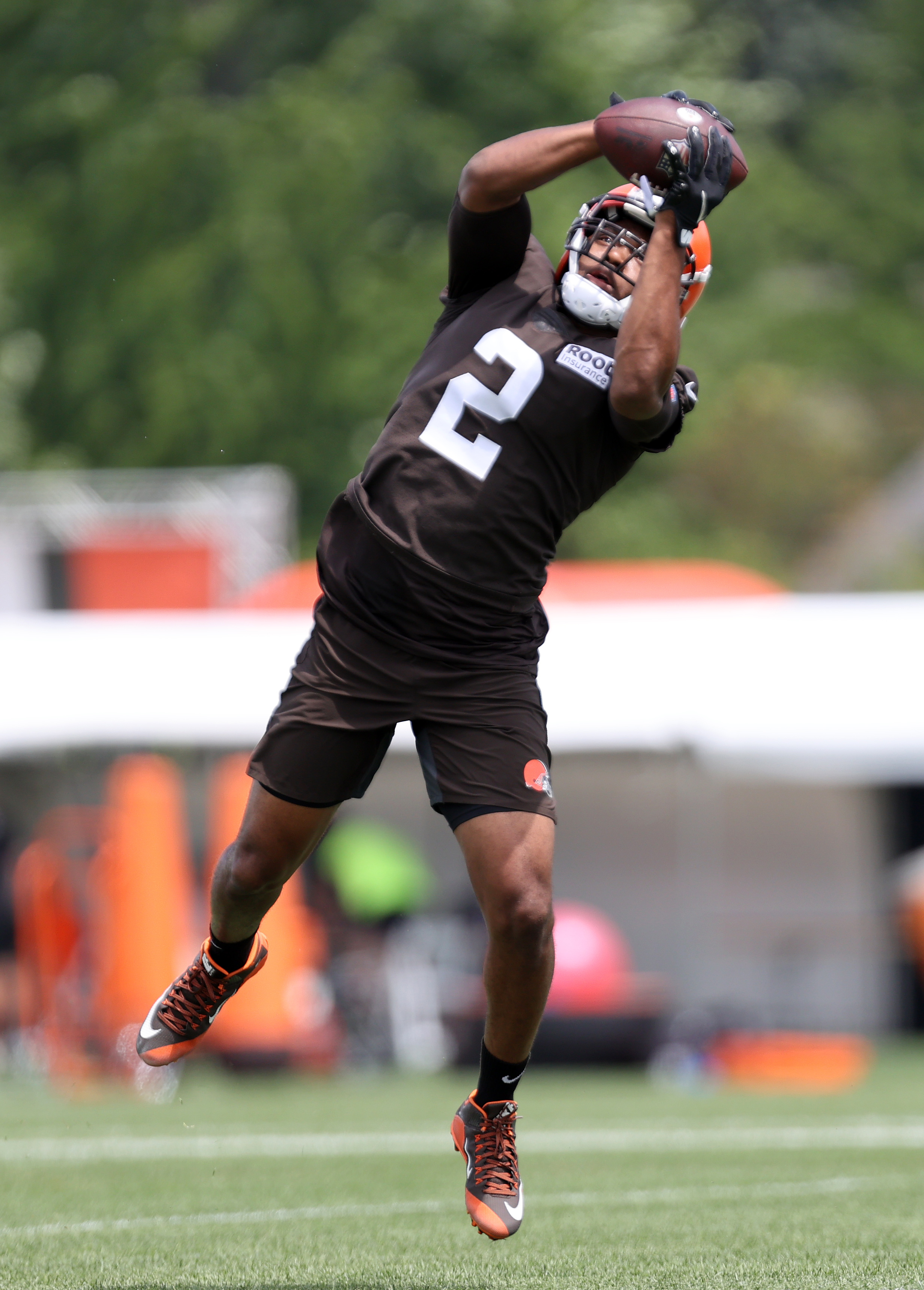 Cleveland Browns tackle James Hudson III warms-up drill during an