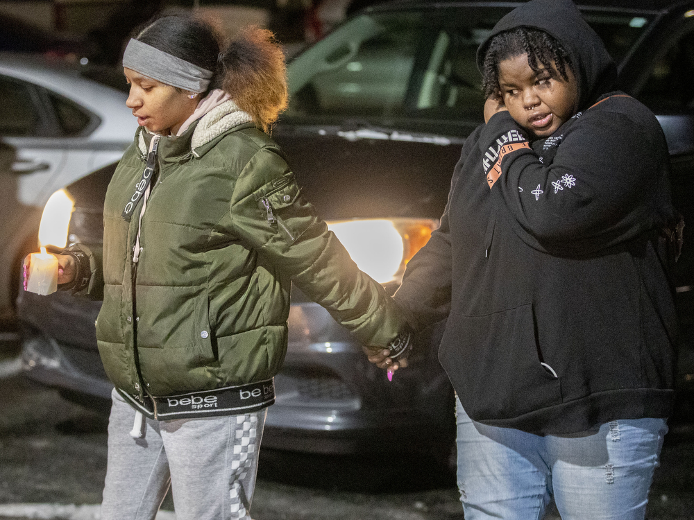 Family and friends of Xavier “Junior” King light candles after releasing balloons outside the bar where he was shot and killed Sunday night in Harrisburg, Pa., Jan. 18, 2022.Mark Pynes | mpynes@pennlive.com