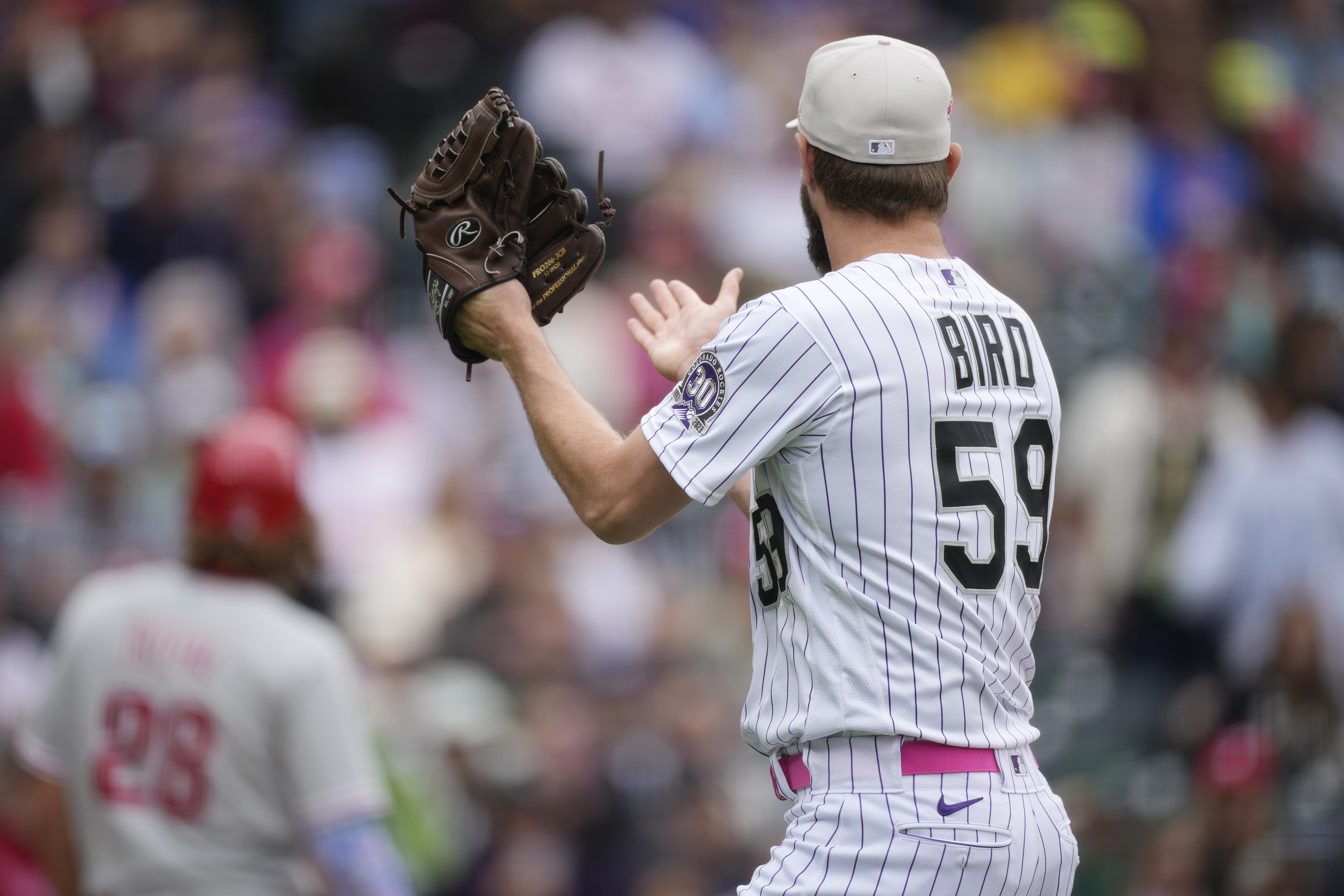 Phillies' Bryce Harper ejected after charging Rockies dugout