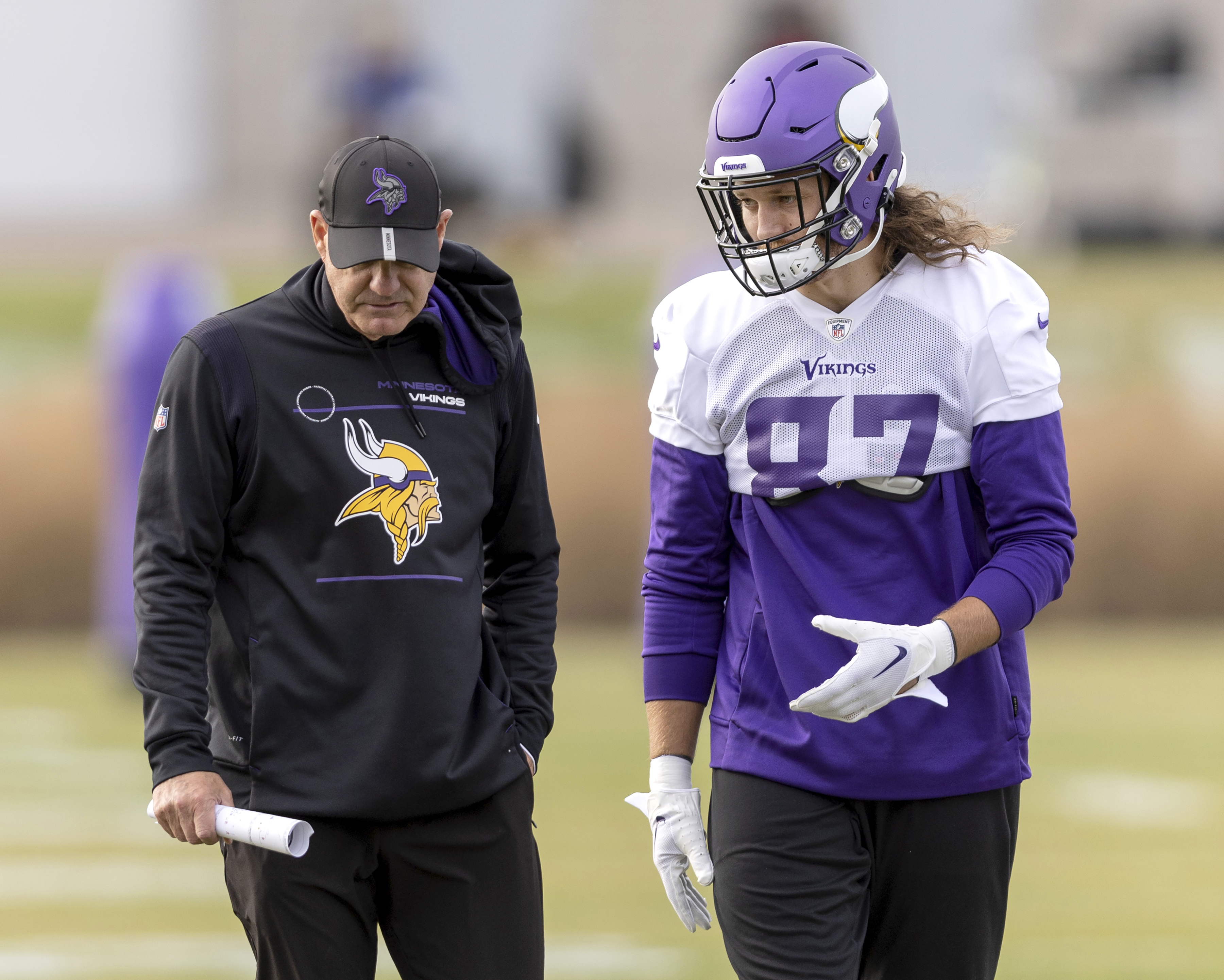 Newly acquired Minnesota Vikings tight end T.J. Hockenson (87) speaks with a coach during NFL football practice on Wednesday, Nov. 2, 2022, in Eagan, Minn. Hockenson has been one of the league’s most productive pass-catching tight ends since the Lions picked him eighth overall in the first round of the 2019 draft out of Iowa. (Carlos Gonzalez/Star Tribune via AP)