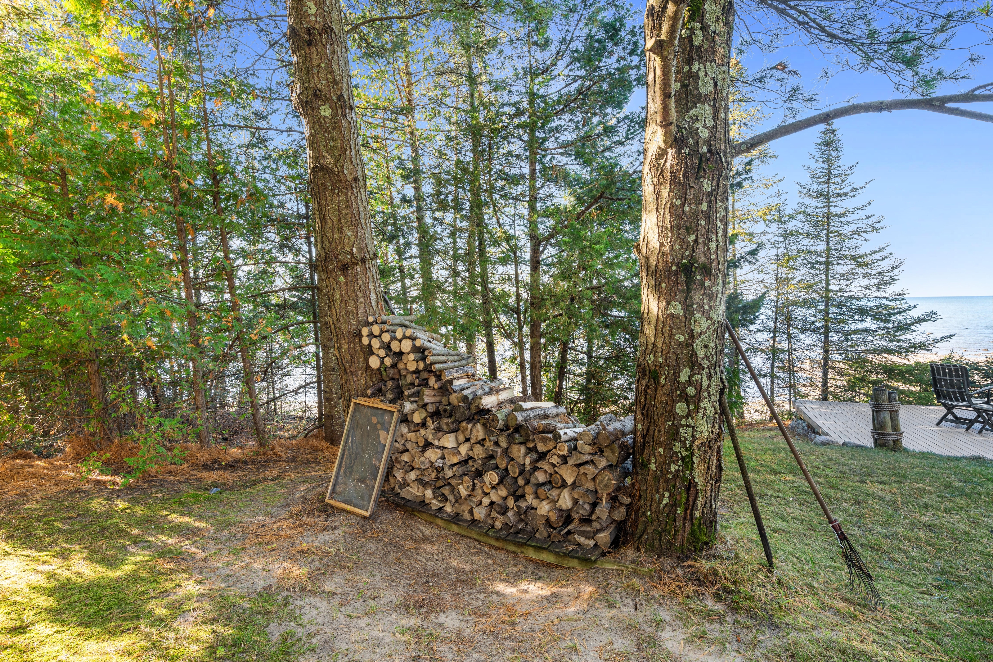 Exterior photographs of 4093 Lake Shore Drive in Charlevoix, this gem is listed at $2,099,900 through Berkshire Hathaway HomeServices Michigan Real Estate – Traverse City and The Crane Group with associate broker Johnny Crane and his brother, co-listing agent Matt Crane.