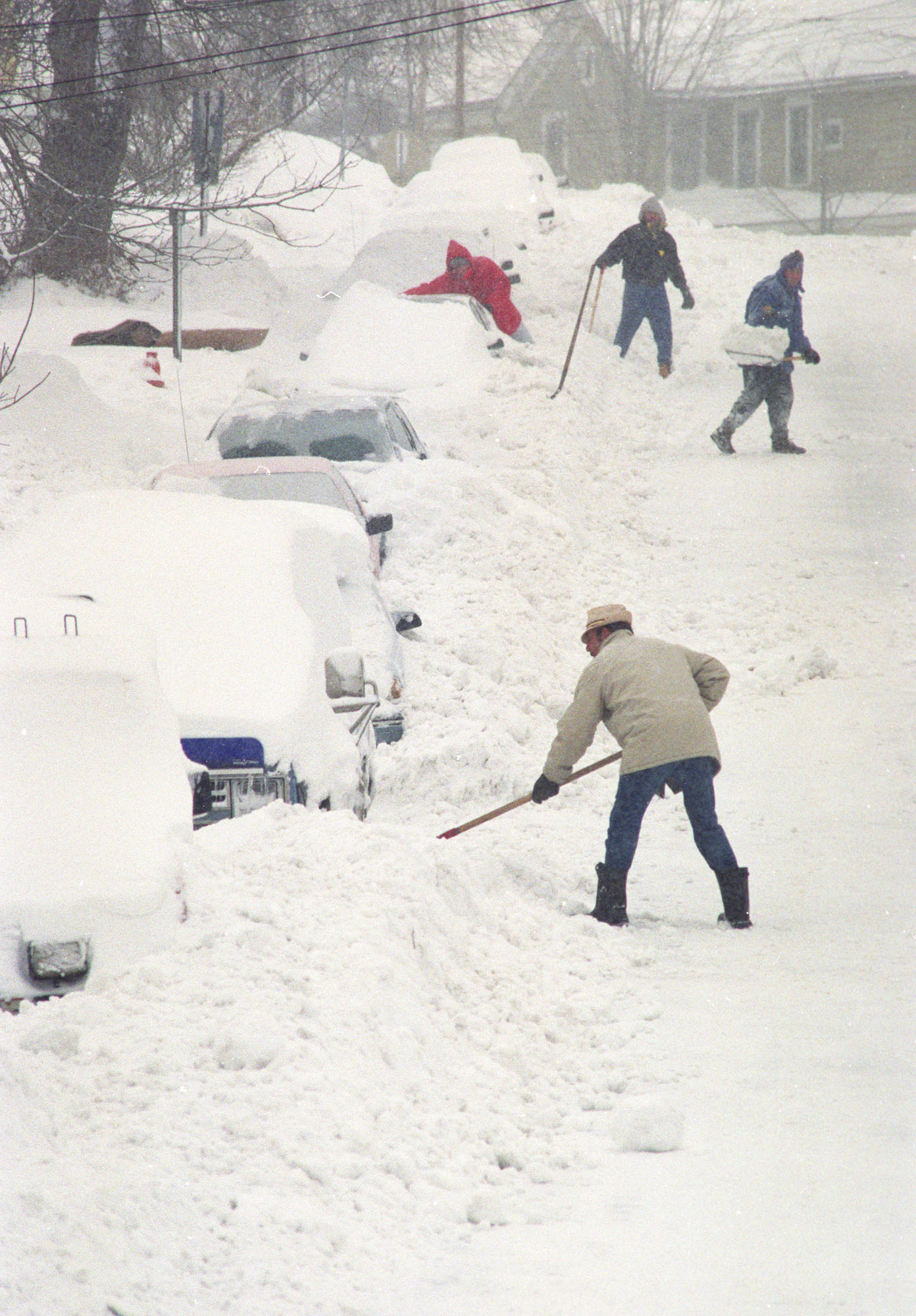 People along Seward Street in Syracuse on March 14, 1993 dig out their cars from the snow storm that dumped some 40 inches of snow on the area. Nicholas Lisi / The Post-Standard