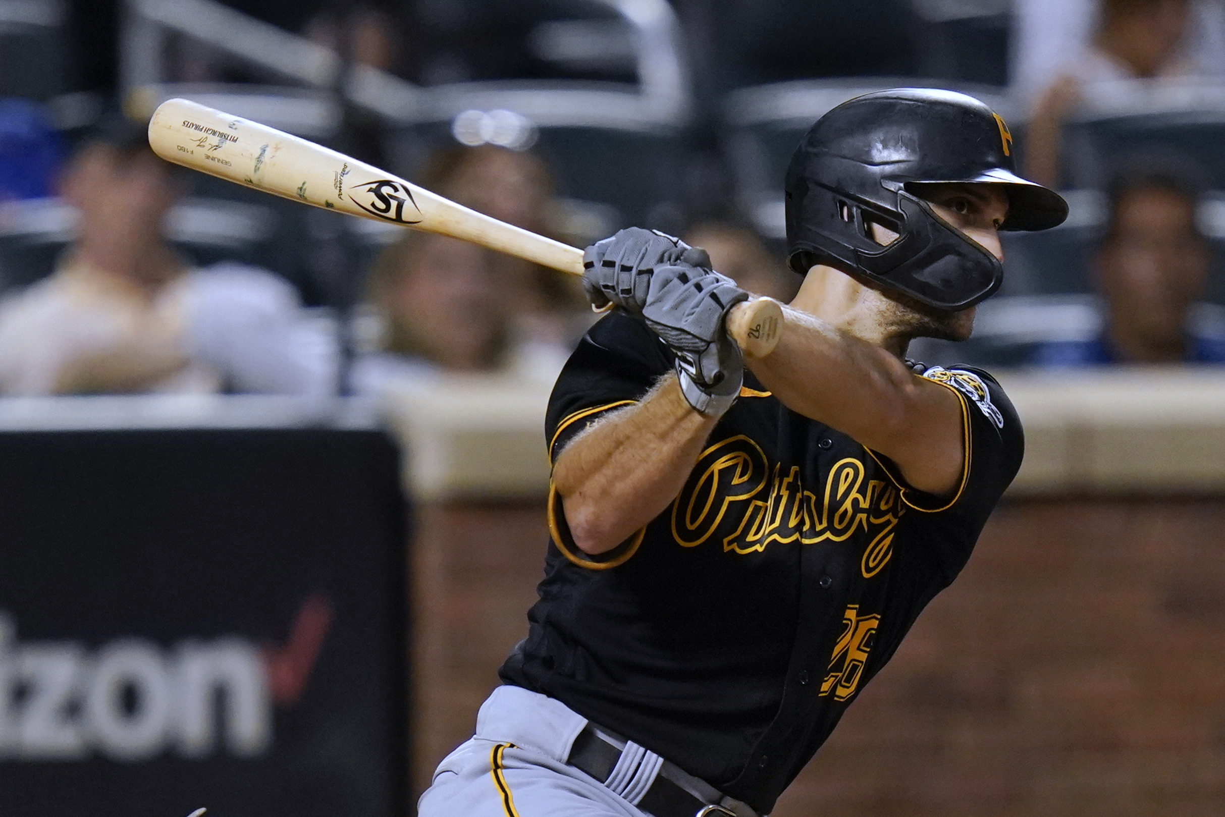 Pittsburgh Pirates' Adam Frazier, right, stands on third base next