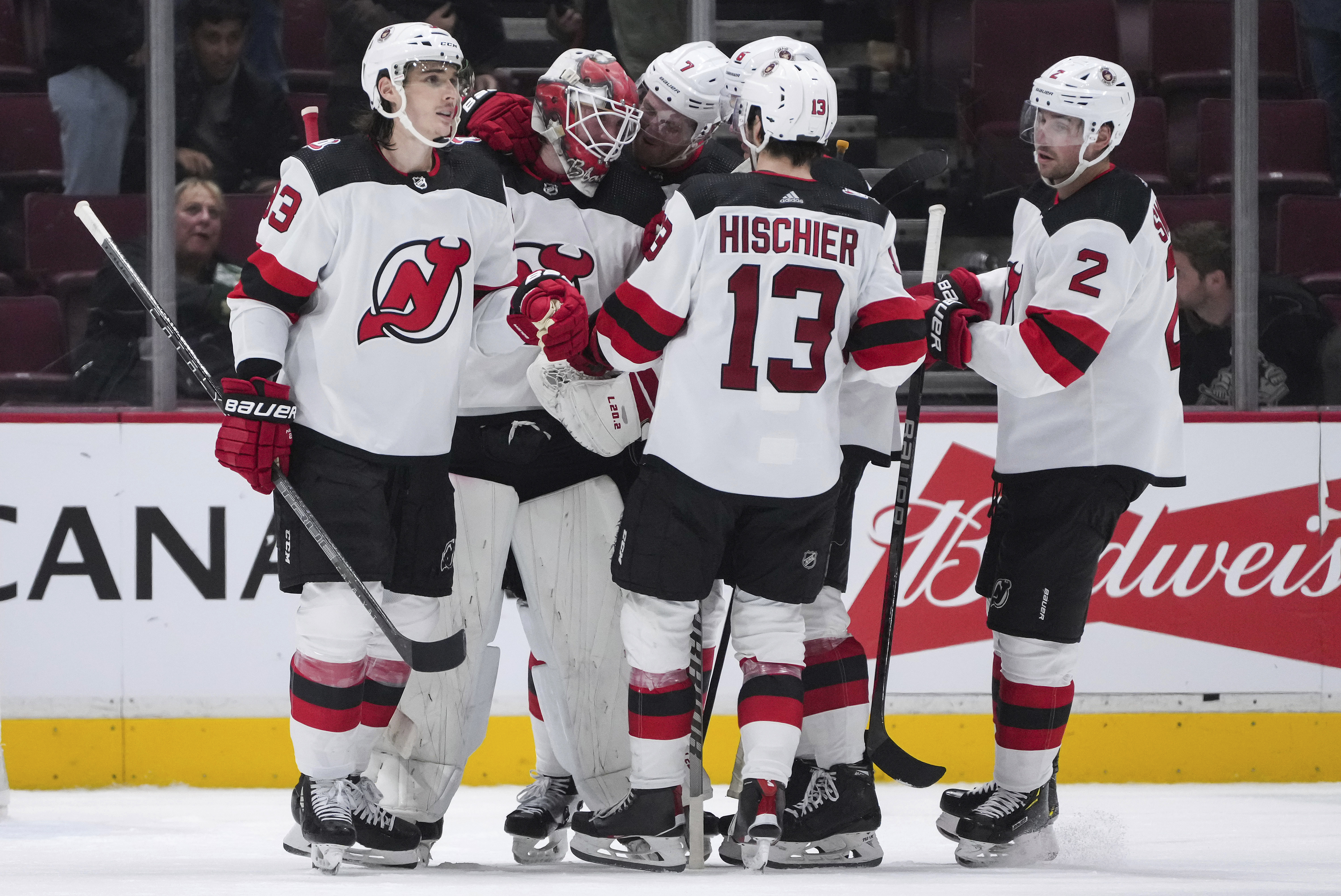 The New Jersey Devils team skates out on the ice after the winning