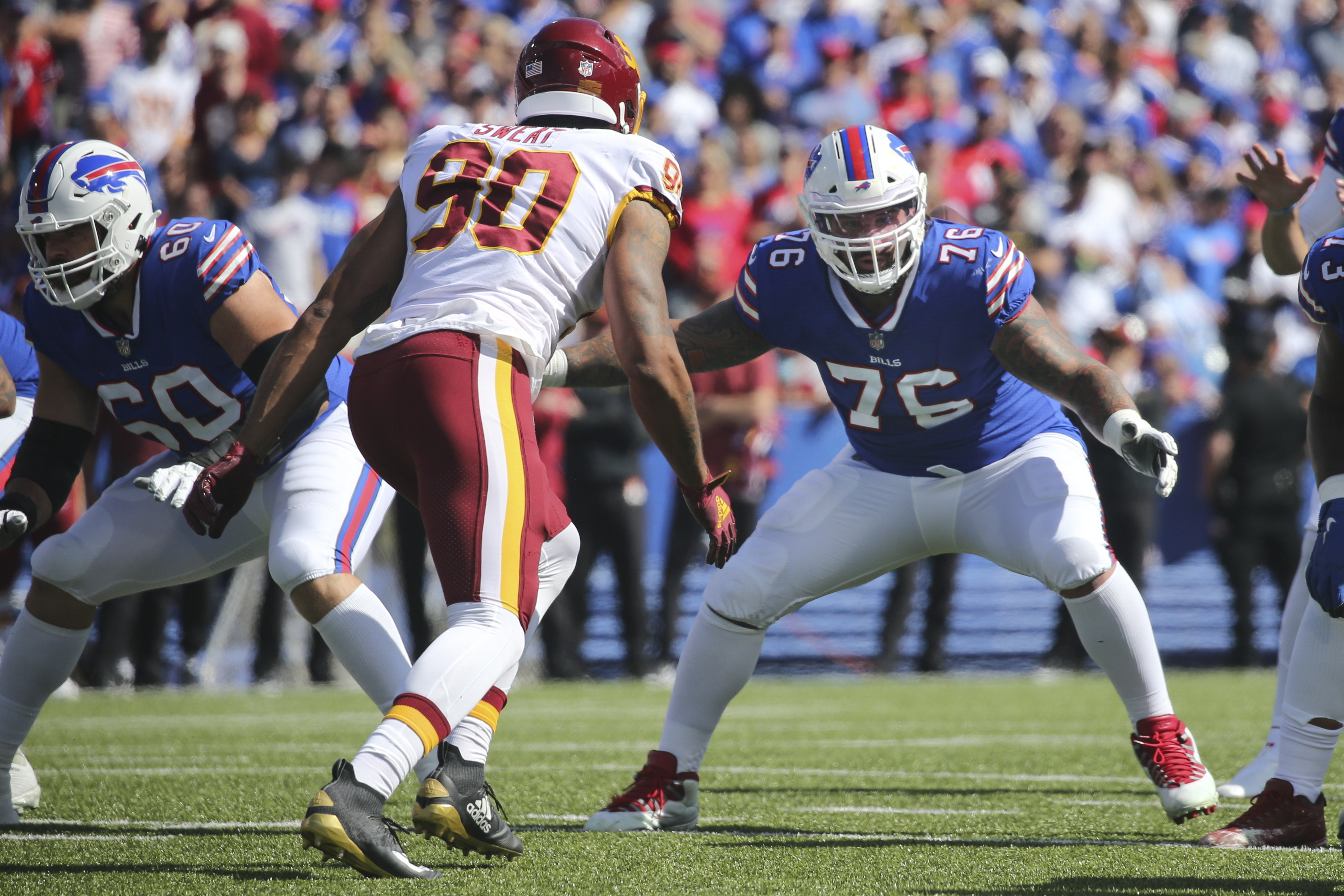 Washington Football Team's Antonio Gibson (24) runs away from Buffalo Bills  defenders for a touchdown during the first half of an NFL football game  Sunday, Sept. 26, 2021, in Orchard Park, N.Y. (