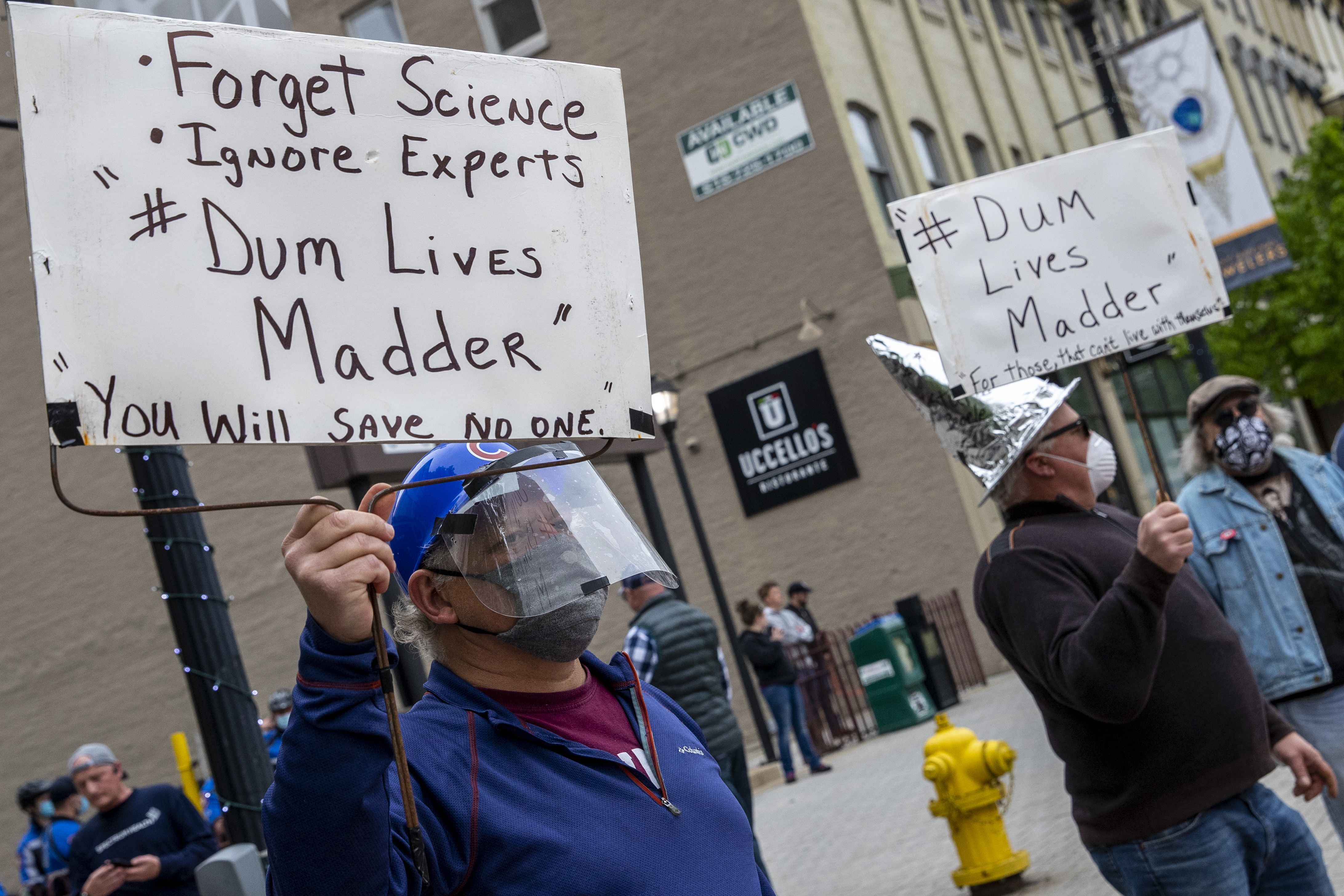 Mike Harris, left, of Ada, protests against the protesters at the "American Patriot Rally-Sheriffs speak out" event at Rosa Parks Circle in downtown Grand Rapids on Monday, May 18, 2020. The crowd is protesting against Gov. Gretchen Whitmer's stay-at-home order. (Cory Morse | MLive.com)